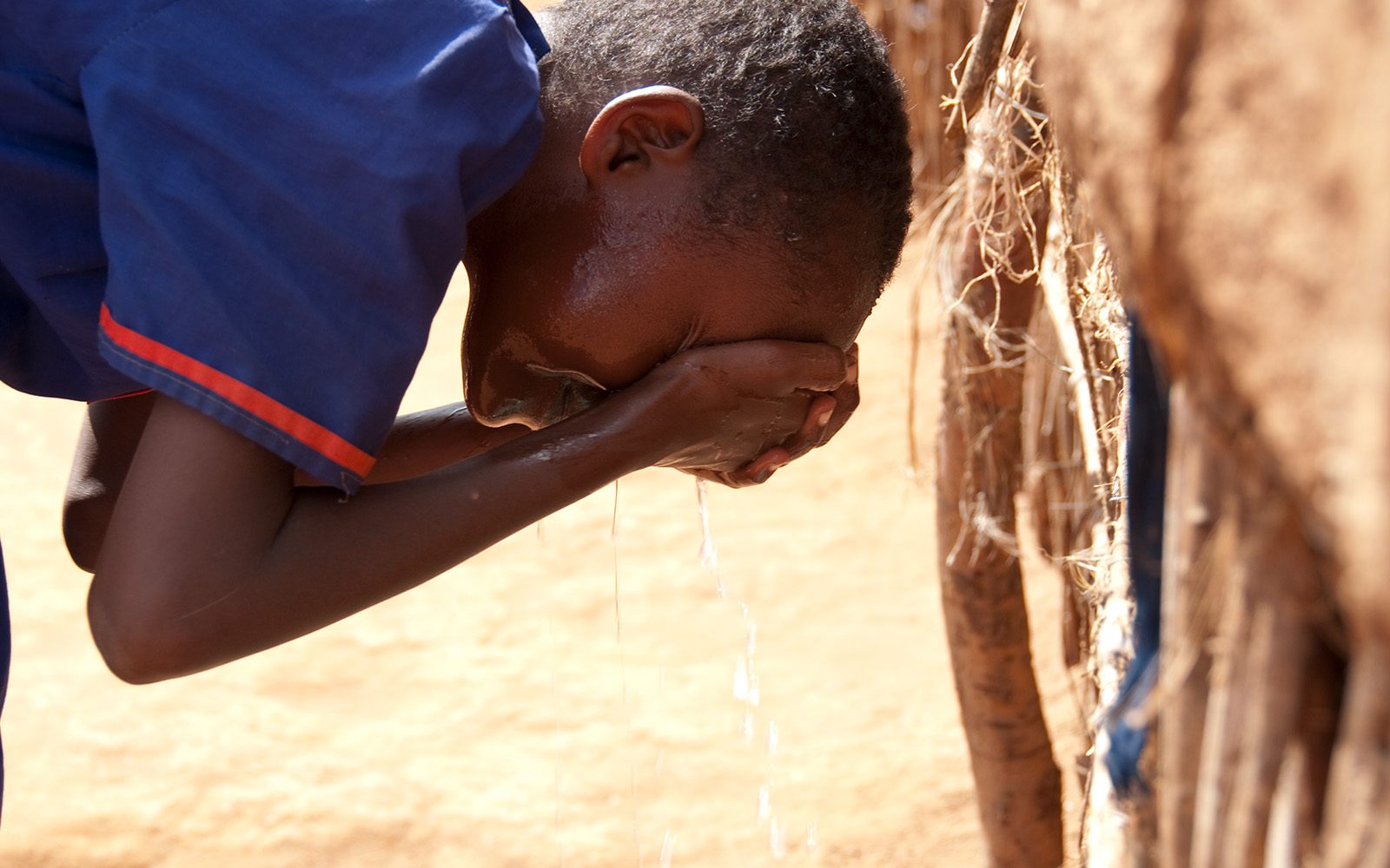 Kenya Simila washing her face