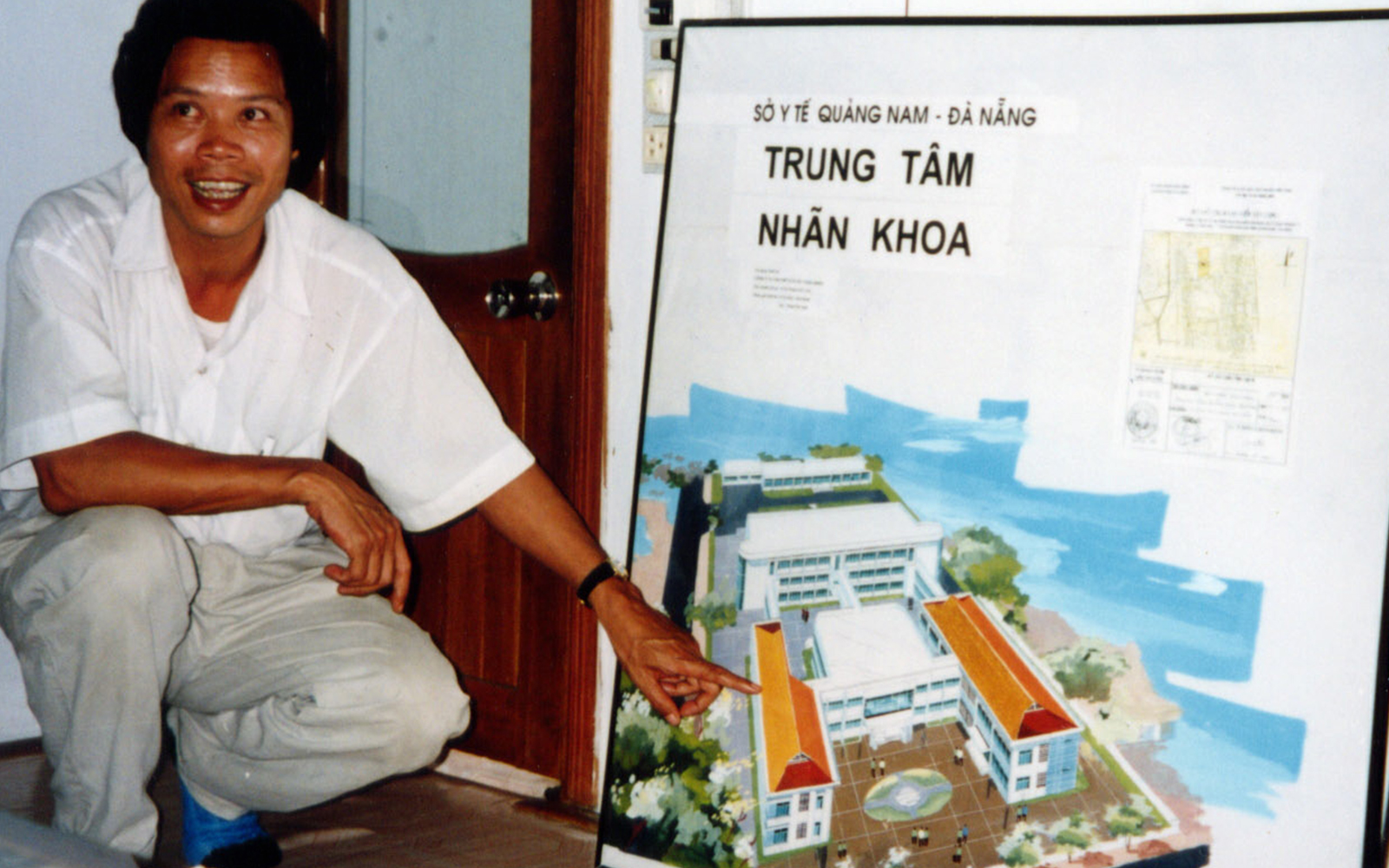 Dr Phan Binh with an old diagram Da Nang Eye Hospital