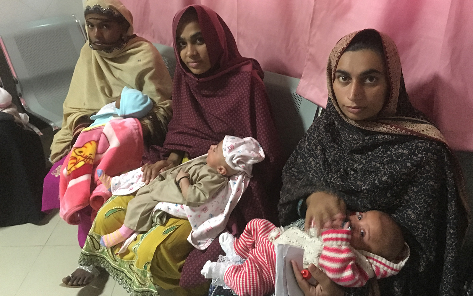 Pakistan 3 women wait for eye test for babies