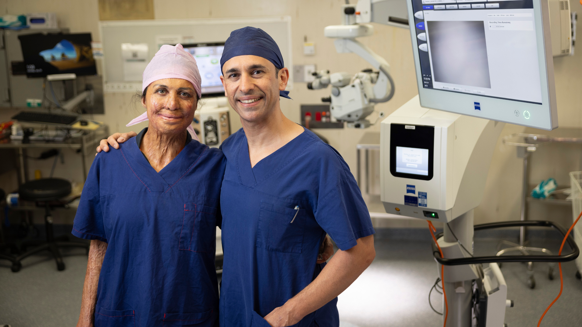Ambassador Turia Pitt in scrubs standing next to Dr Kris Rallah Baker