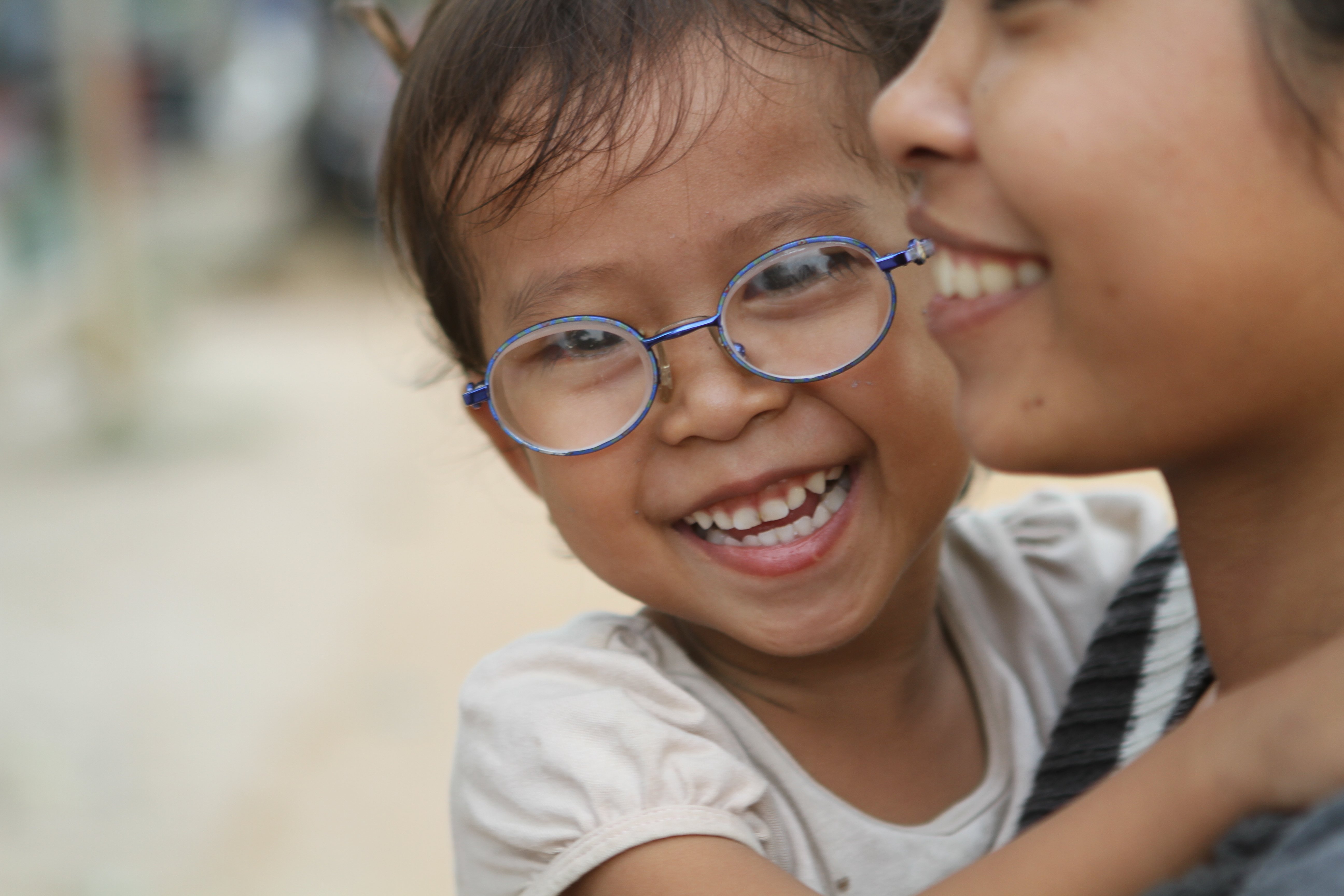 Vann smiles after getting new glasses.