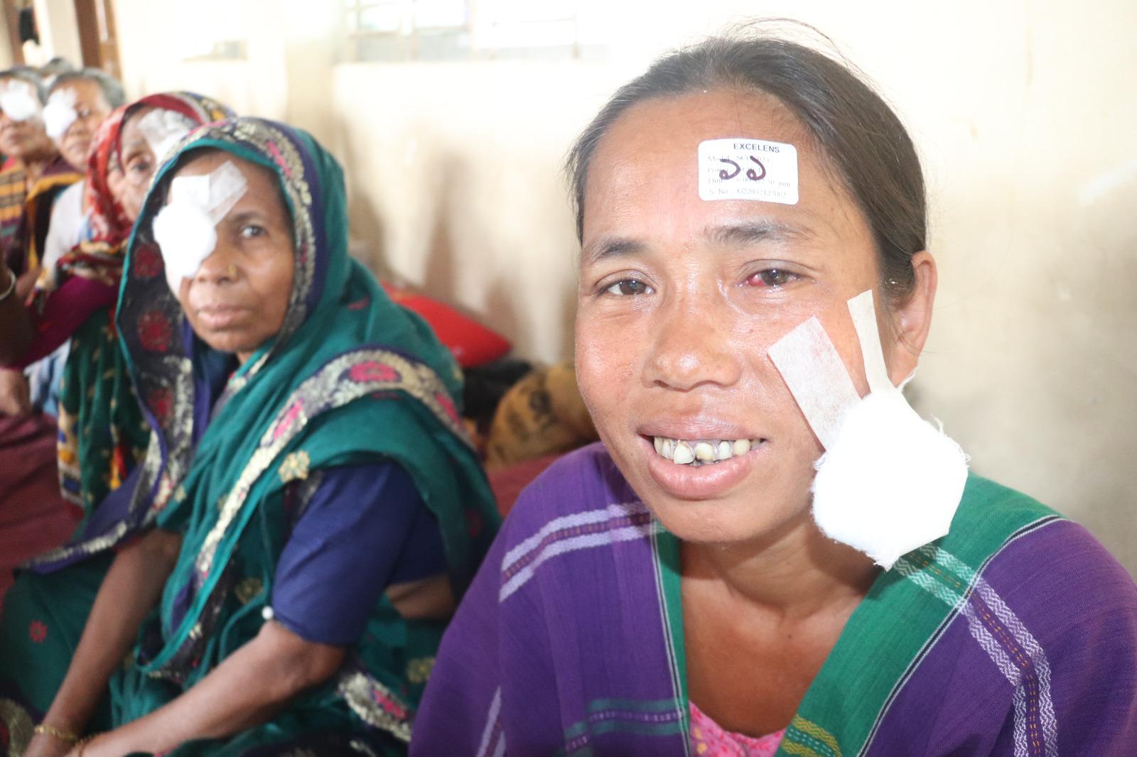 Ani Chakma smiling after her patch is removed from eye surgery. She can see again.