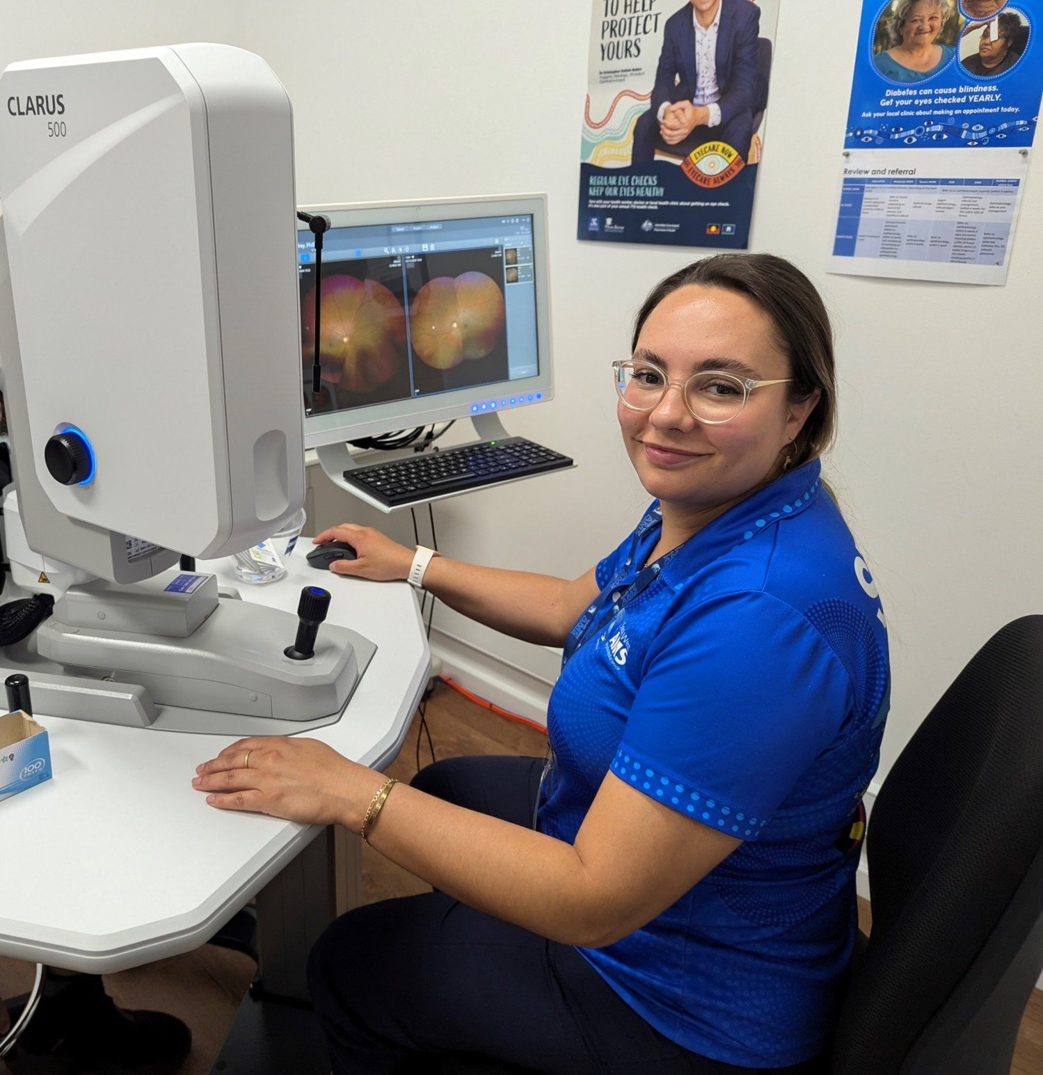 Sarah Haynes looking at imaging of an eye. 