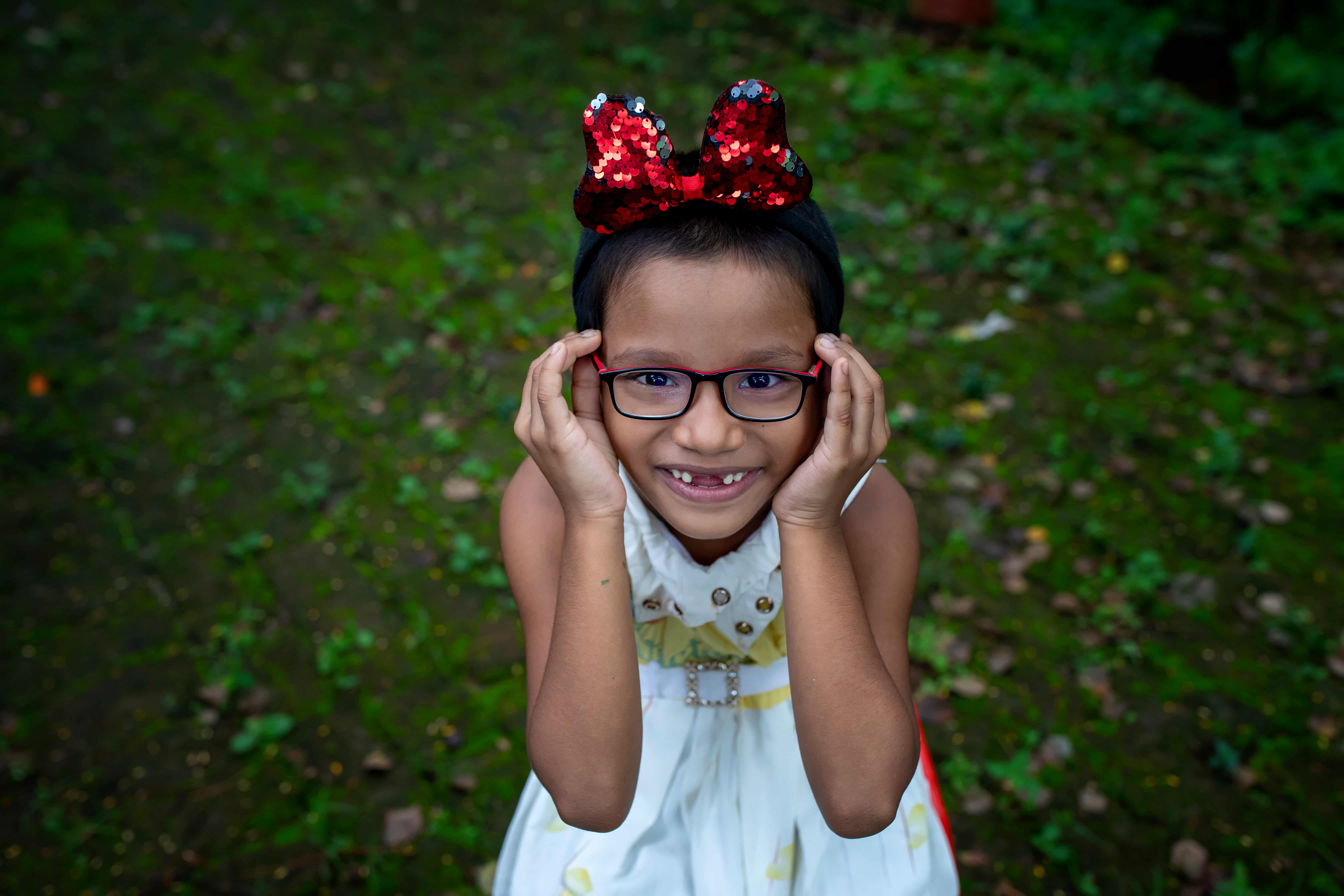 Shradhdha smiles after receiving glasses to correct her uncorrected refractive error at Grameen GC Eye Hospital in Barishal.