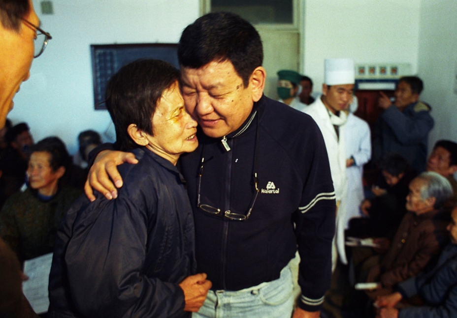 Our work has taken us to some of the world’s most challenging places. At a surgical training workshop in North Korea, a patient embraces Nepalese eye surgeon Dr Sanduk Ruit after her cataract surgery.