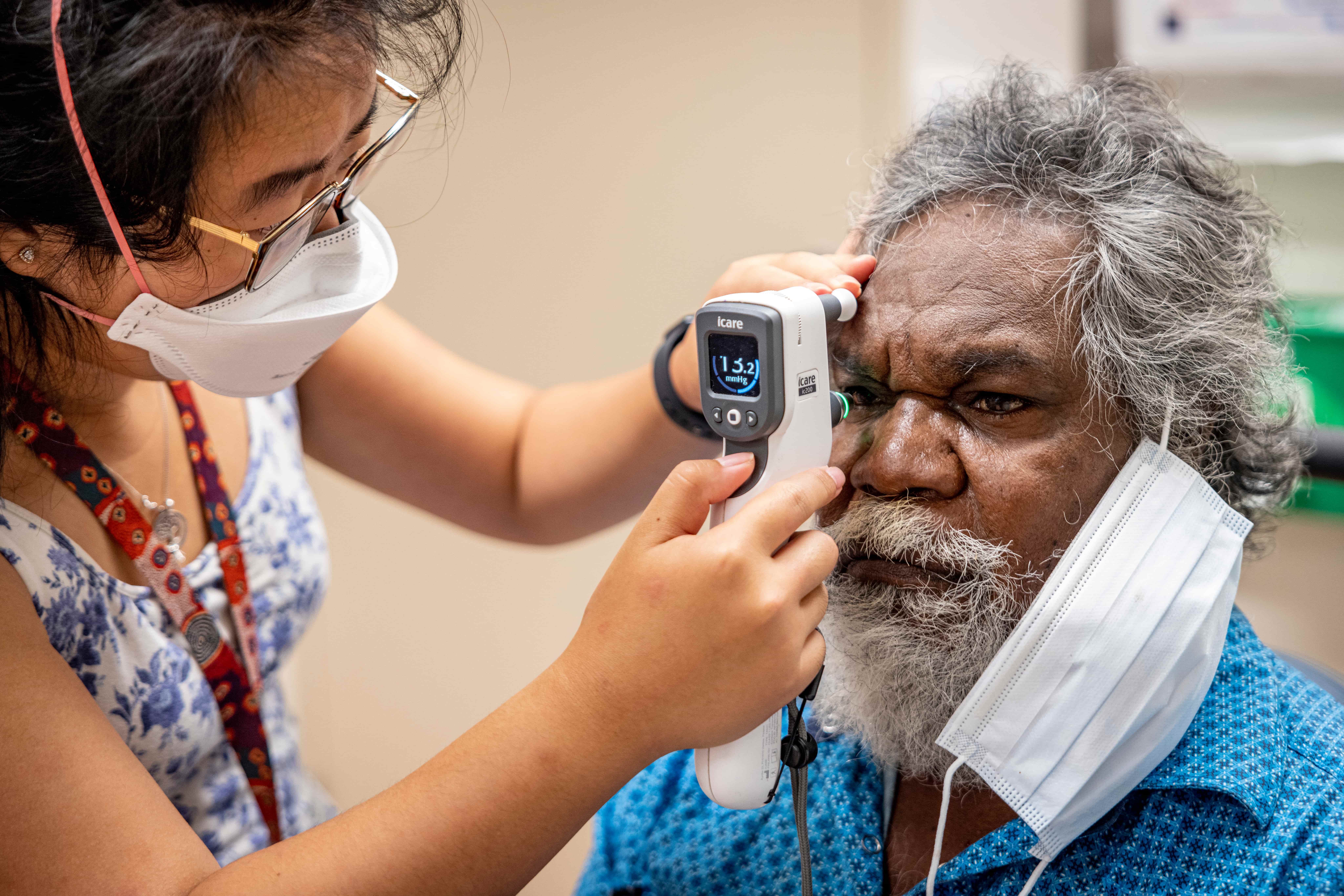 Jeffrey Foster having his eyes screened by a health worker as part of an eye check in the Northern Territory.