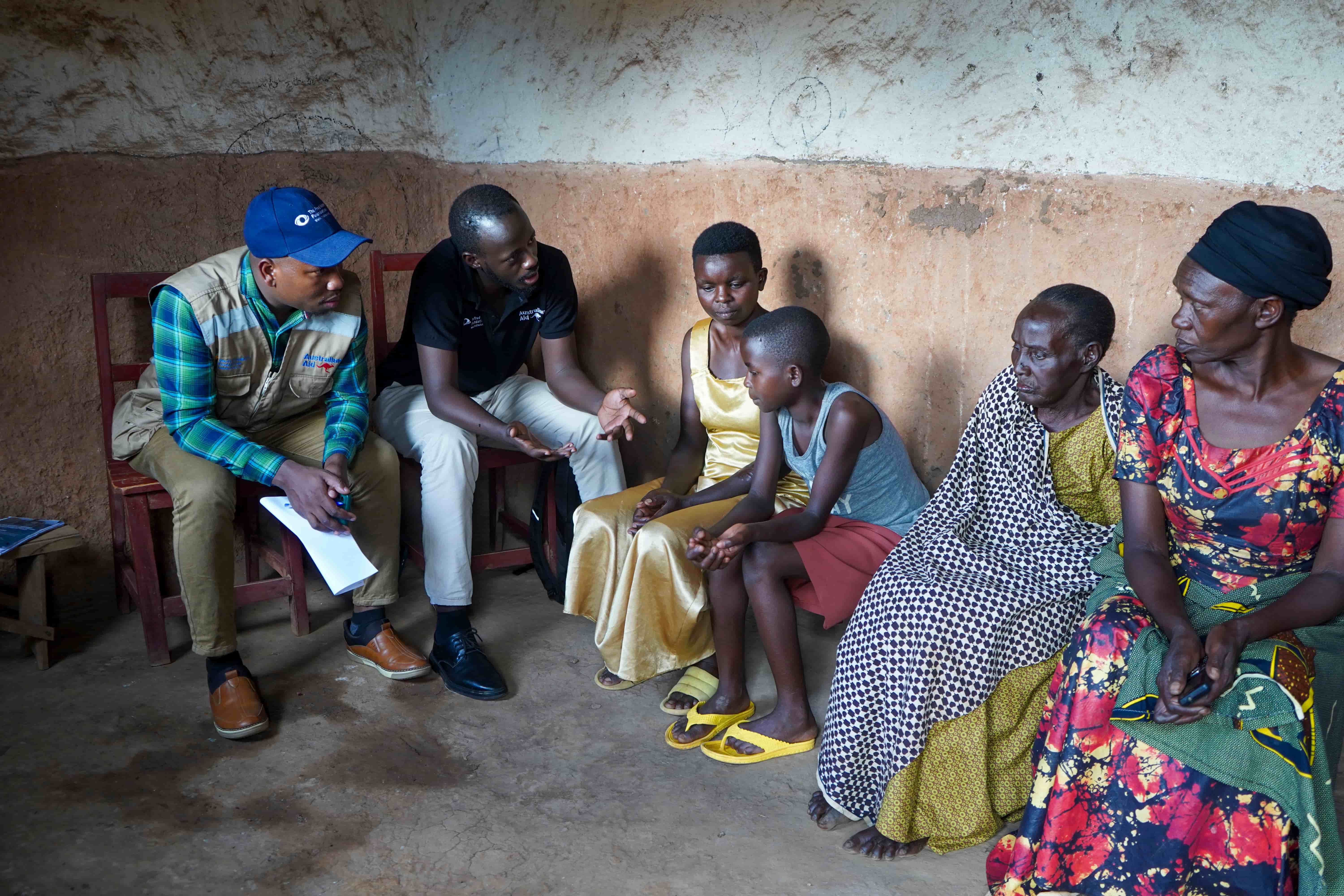The family being screened at home by health outreach workers