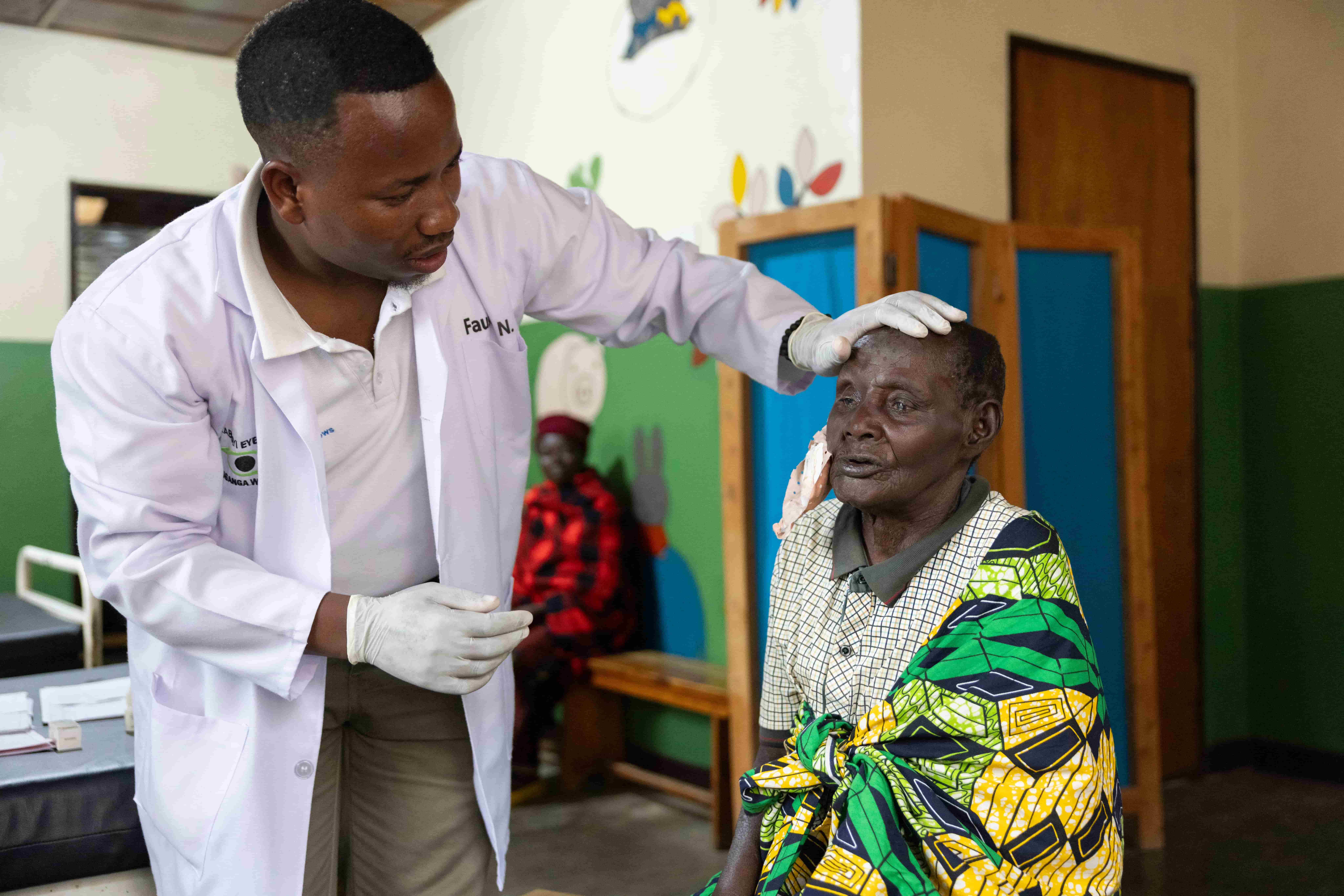  Athanasie having her eye patches removed after surgery