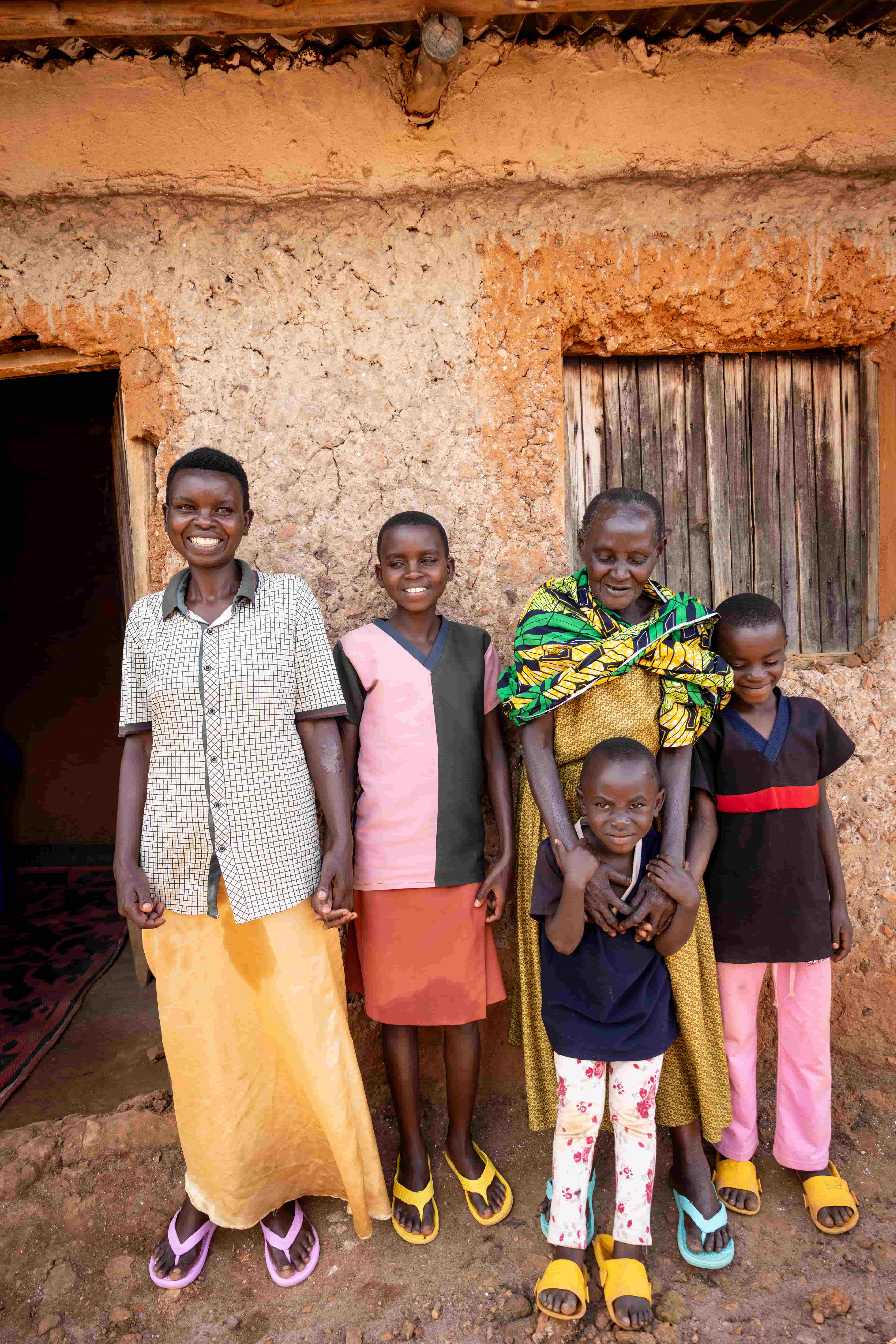 Valentine at home with her family, and a new lease on life after her sight was restored.