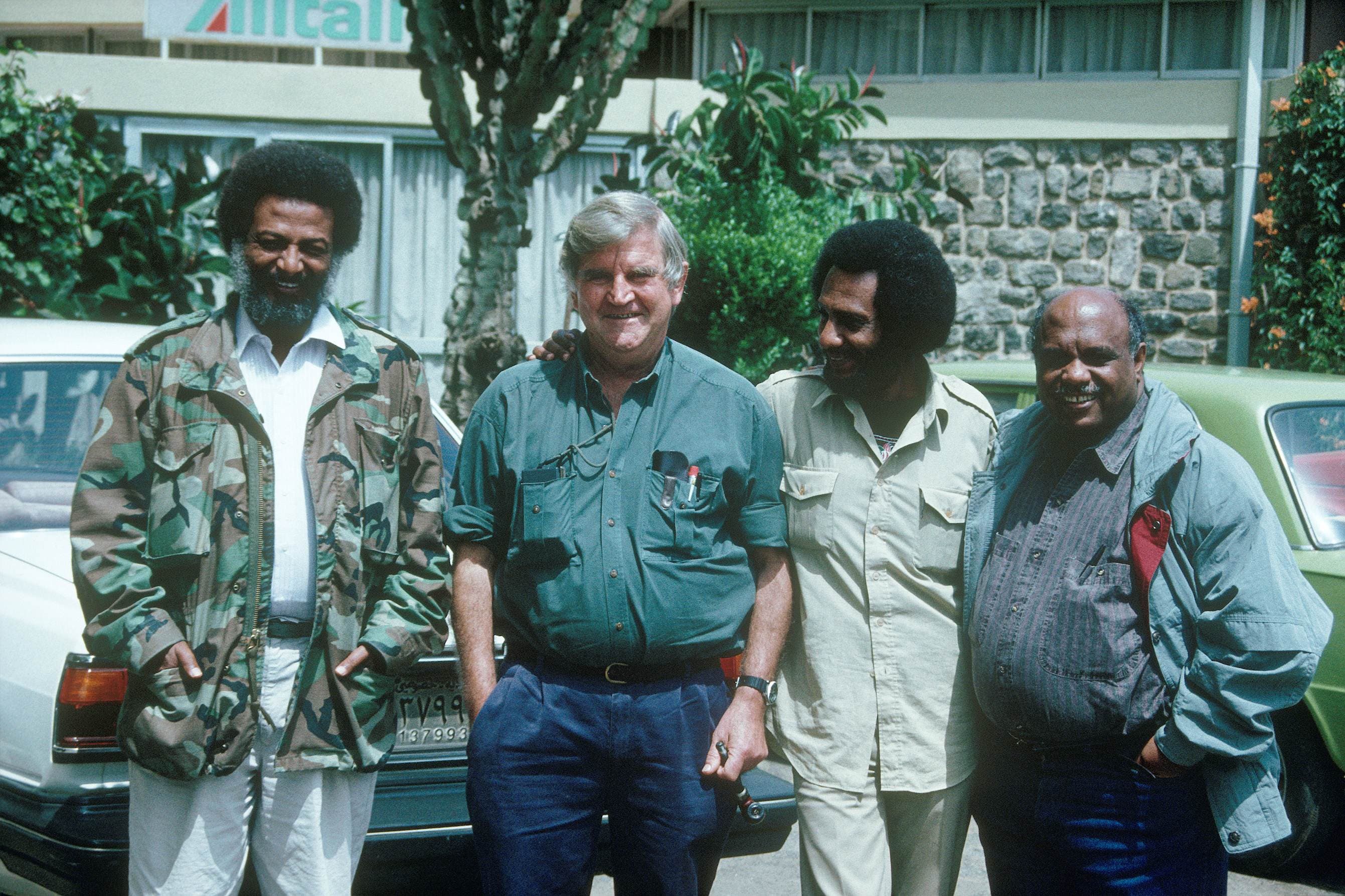 (Left to right) Dr Assefaw, Professor Fred Hollows, Dr Desbele Ghebreghergis and Dr Nerayo celebrate in Eritrea in 1991 following the end of the war. Fred Hollows first met all three doctors while they were providing frontline care during the conflict.