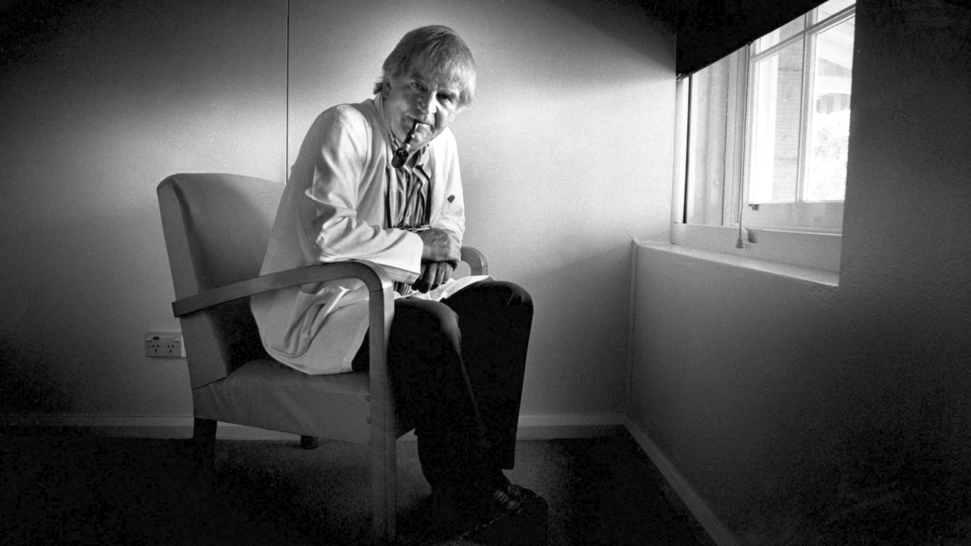 Fred Hollows sitting by a window