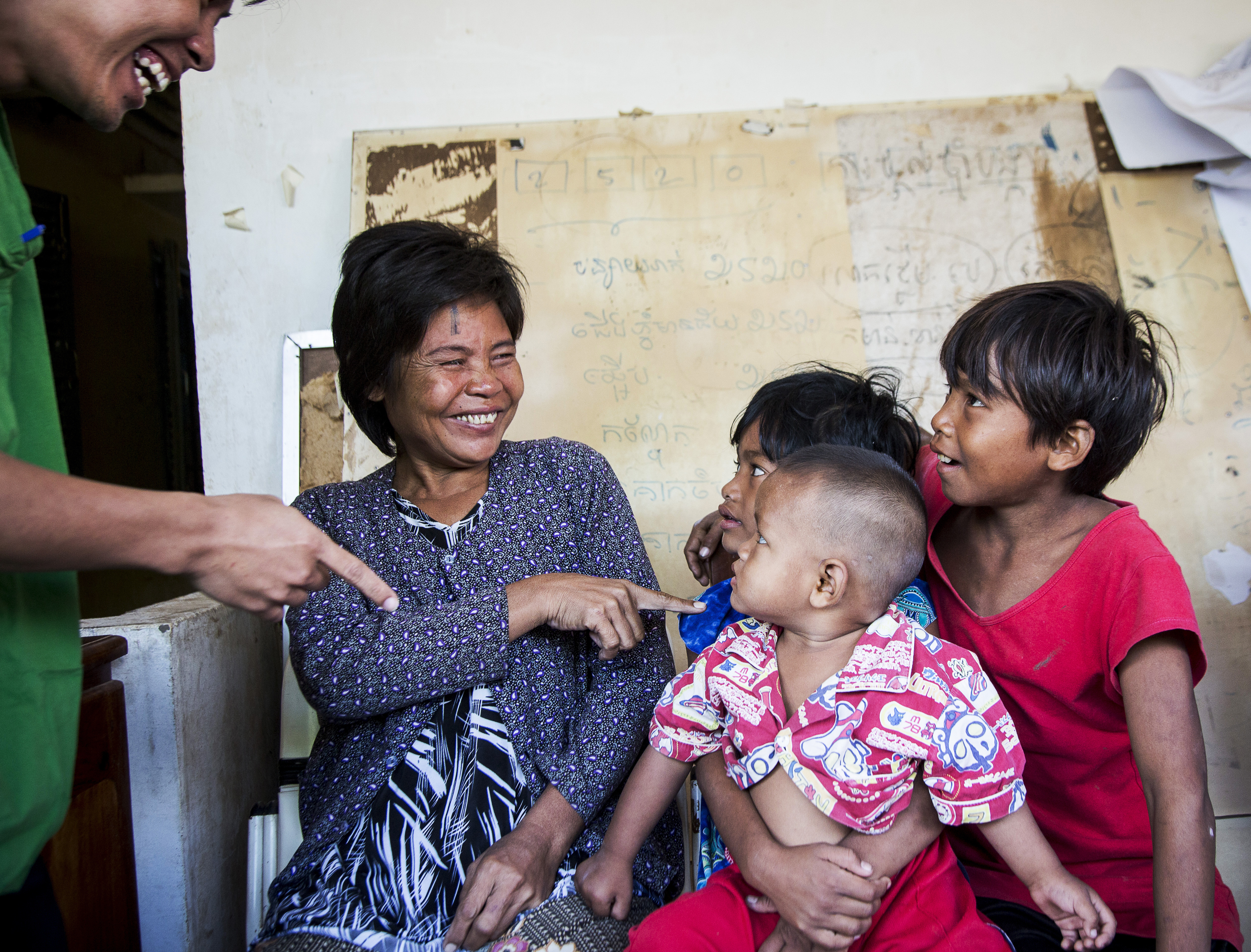 Thol smiles as she sees her children for the first time after cataract surgery.