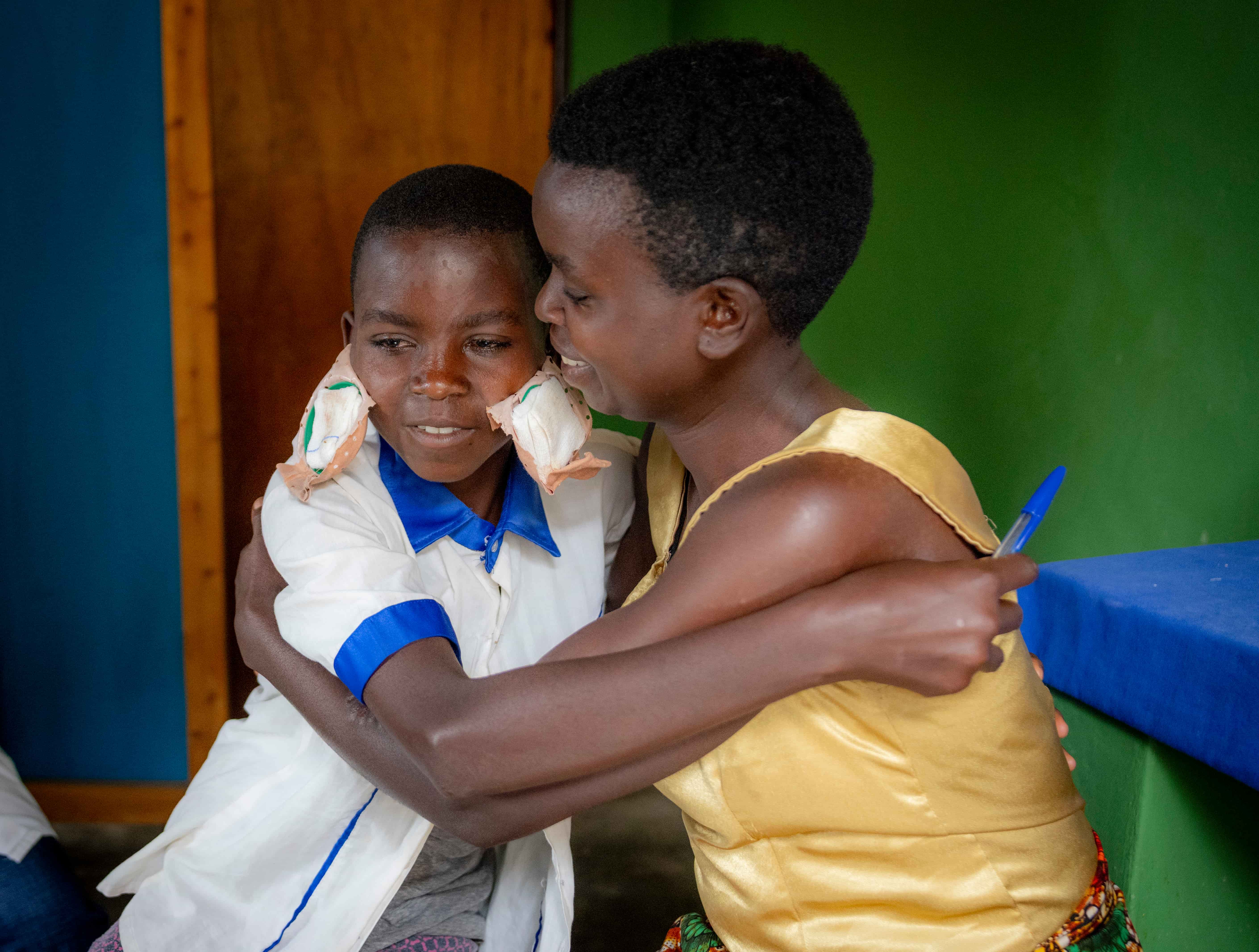 Claudine and her daughter Valentine share a joyful embrace at Kabgayi Eye Unit in Rwanda after Valentine&rsquo;s eye patches are removed following cataract surgery. With her sight restored, Valentine can return to school, while her family looks forward to a more stable future.