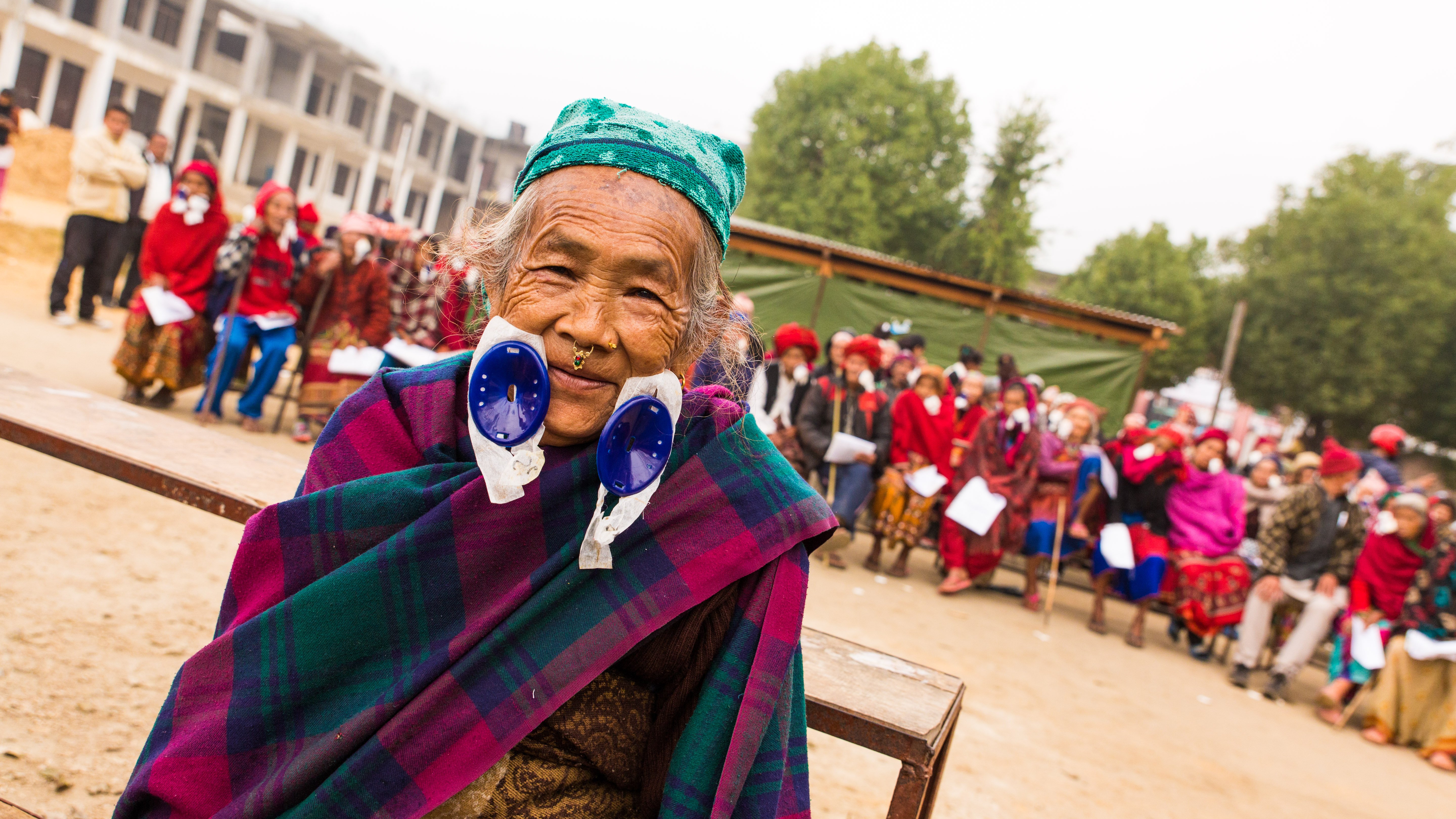 An elderly woman smiles after cataract surgery at an eye surgery camp in Nuwakot.