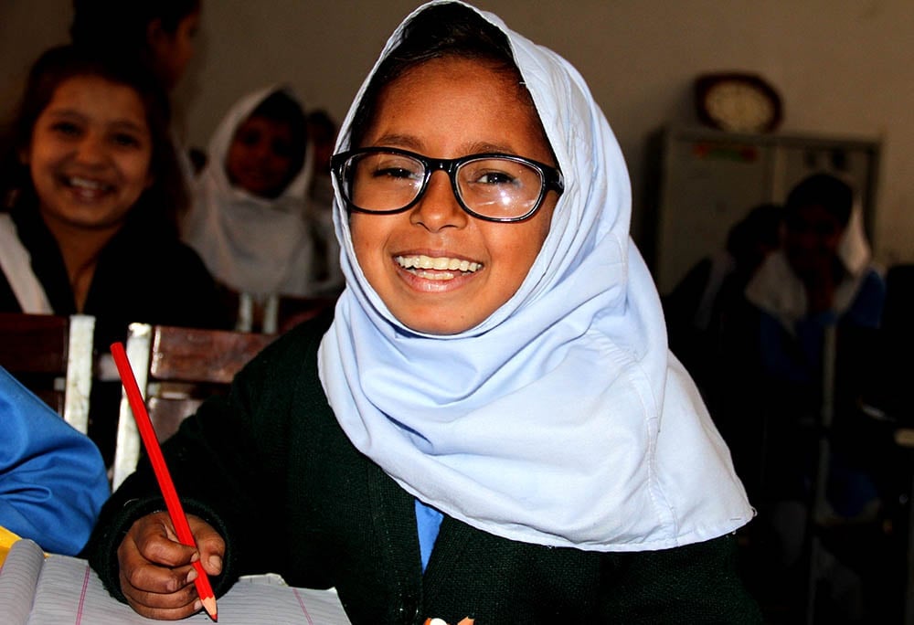 Myopia patient warisha smiling at the camera with her glasses on
