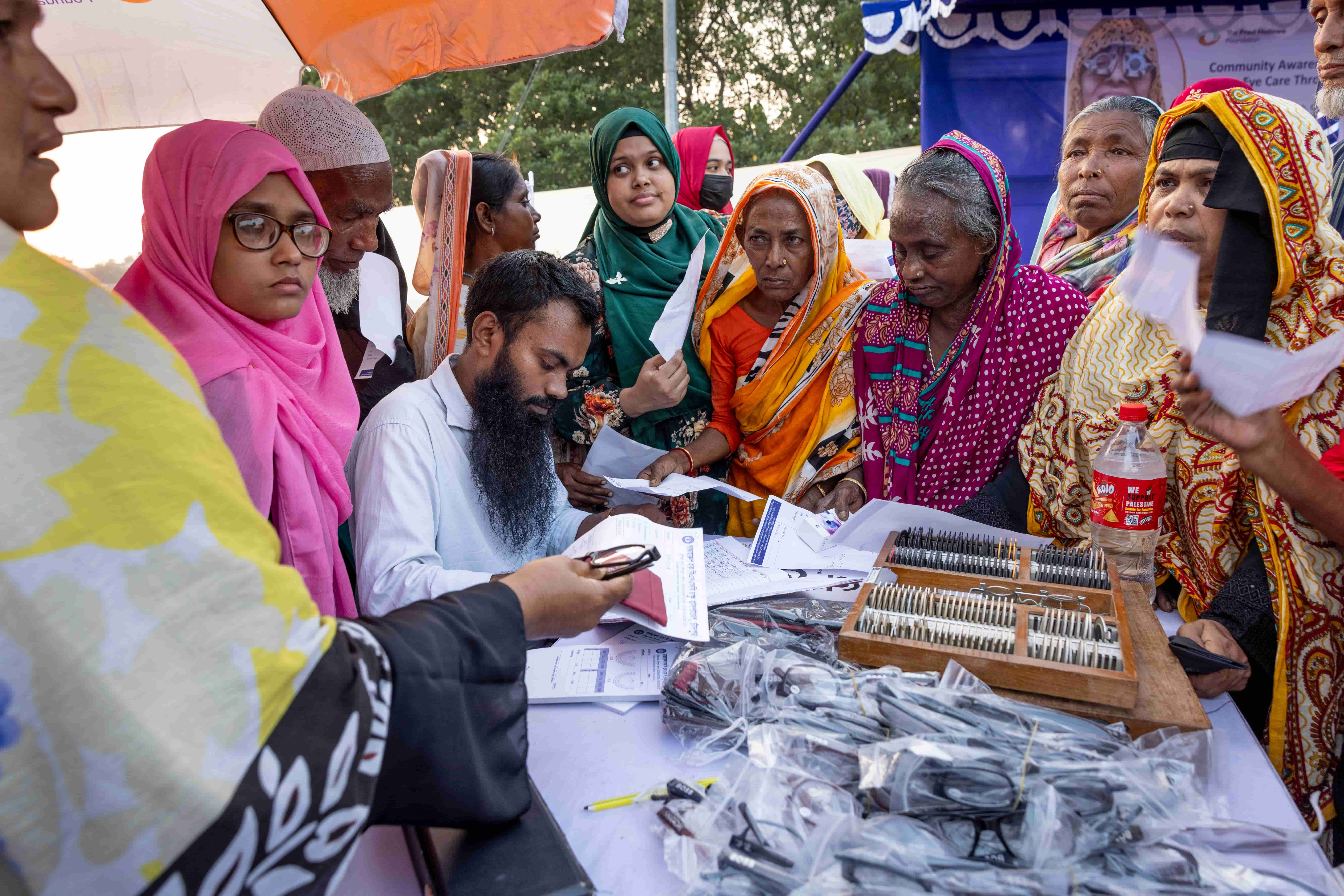 Screened patients waiting to receive their new glasses