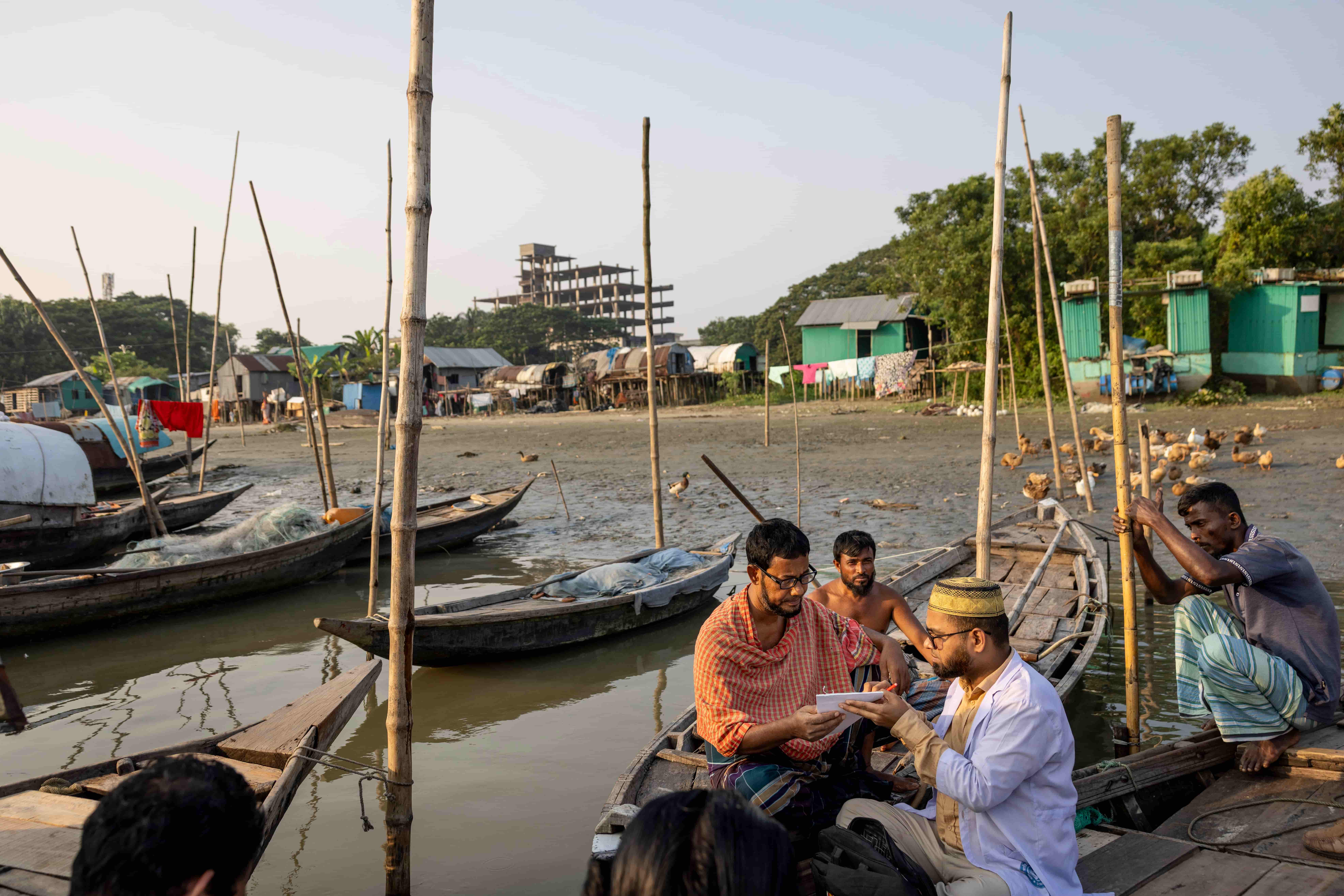 A man being screened on the water on Cox's Bazar