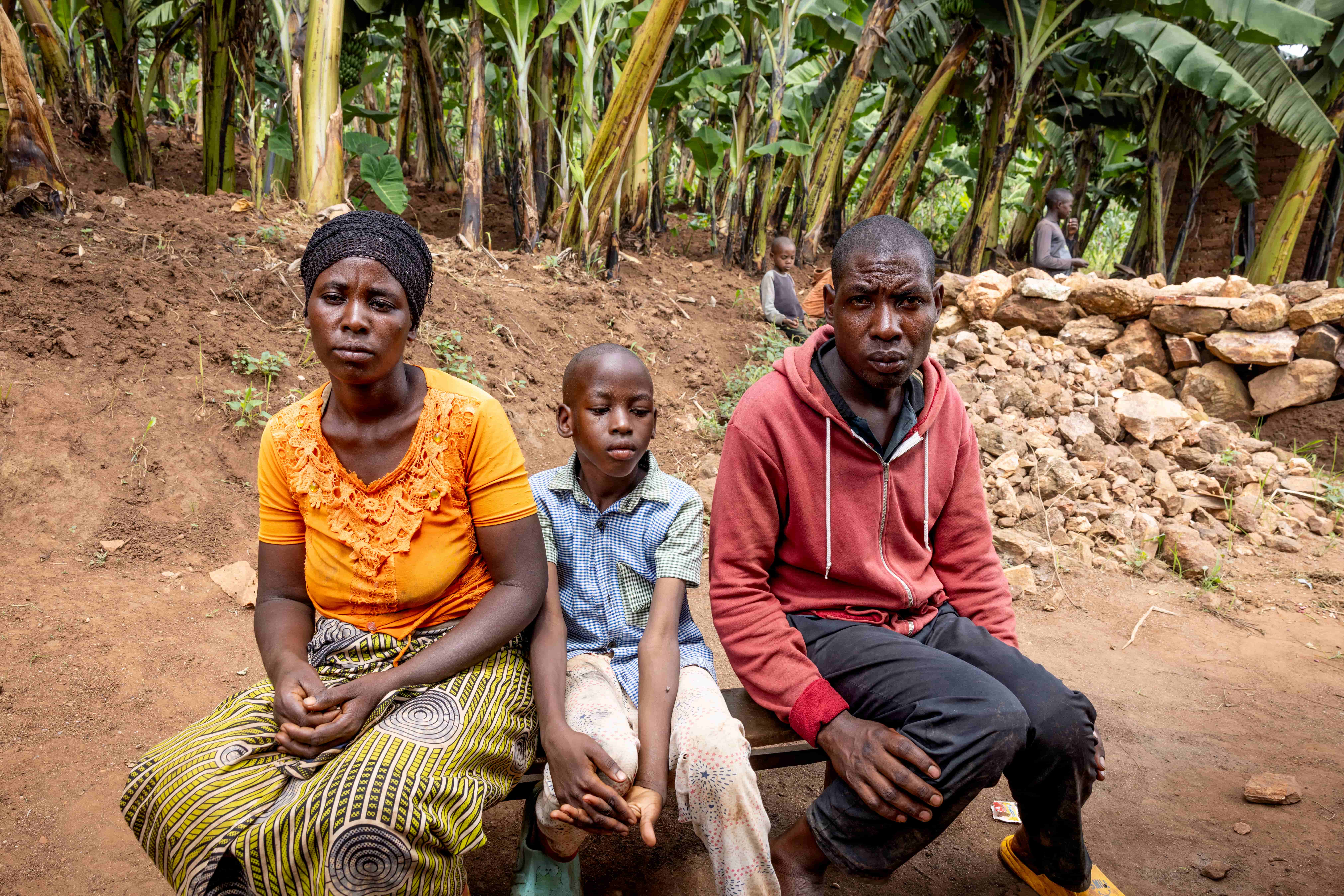 Patrick with his parents in Rwanda