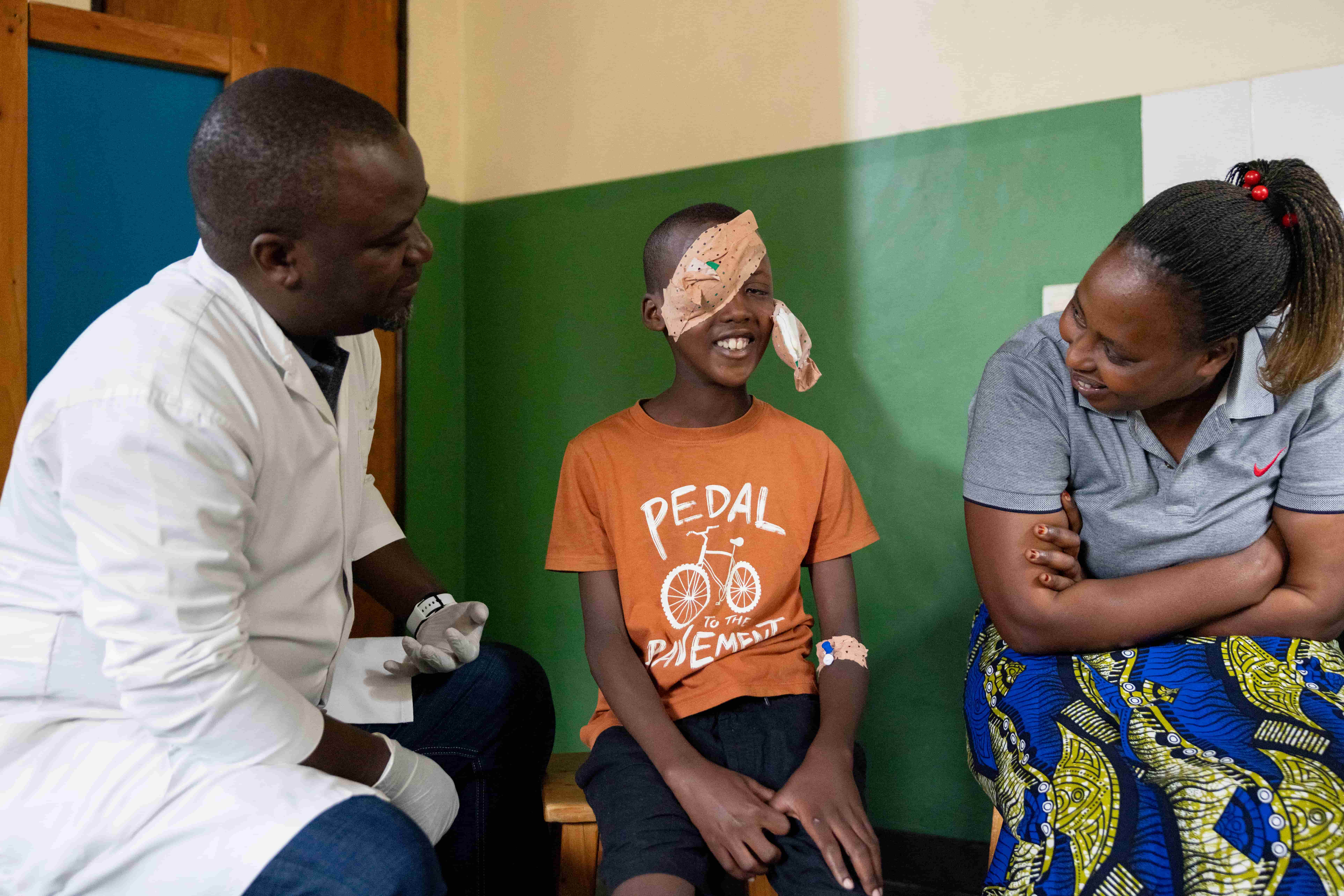 Dr Theophile examines Bright after cataract surgery.