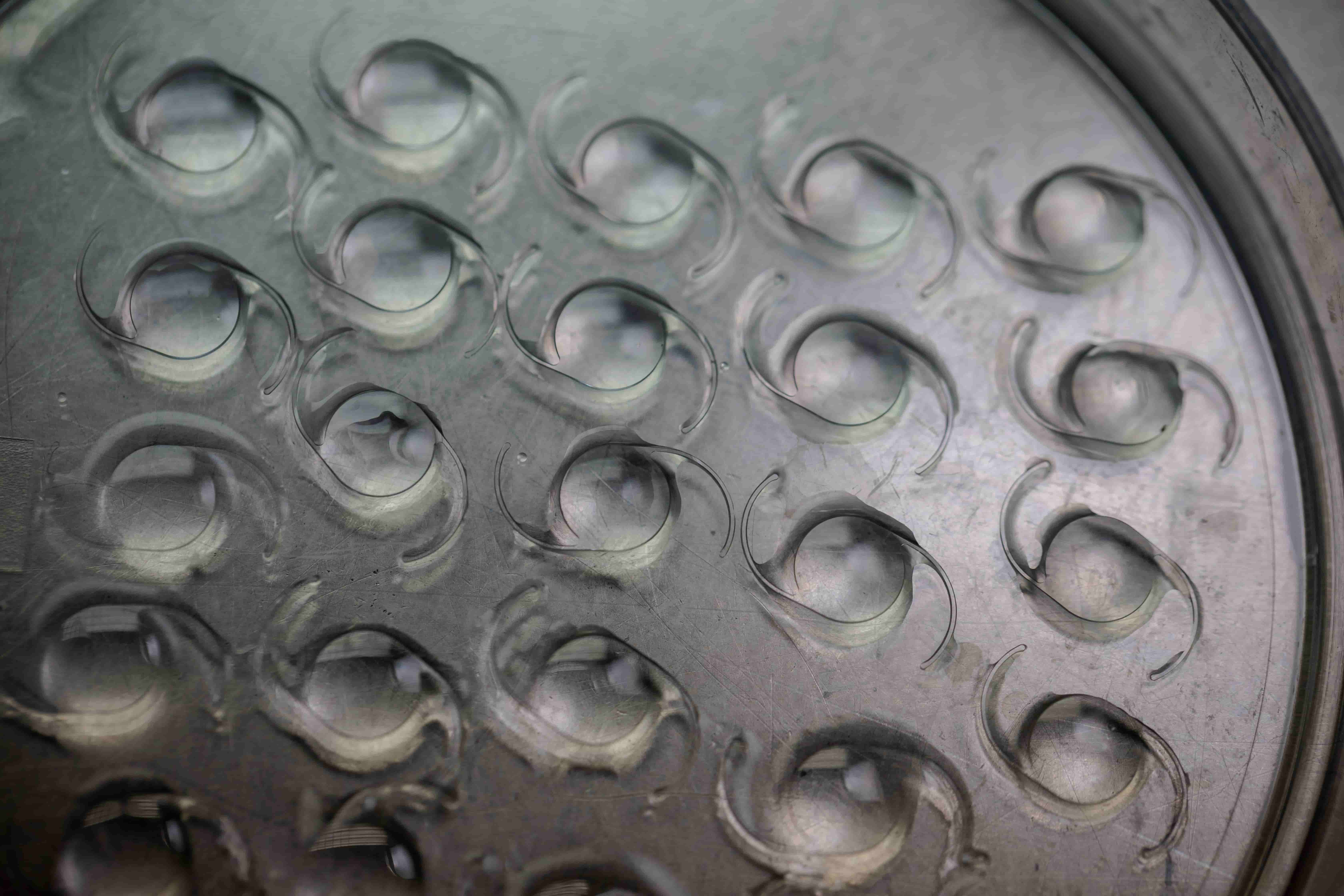 A close-up of multiple intraocular lenses ready for cataract surgery.