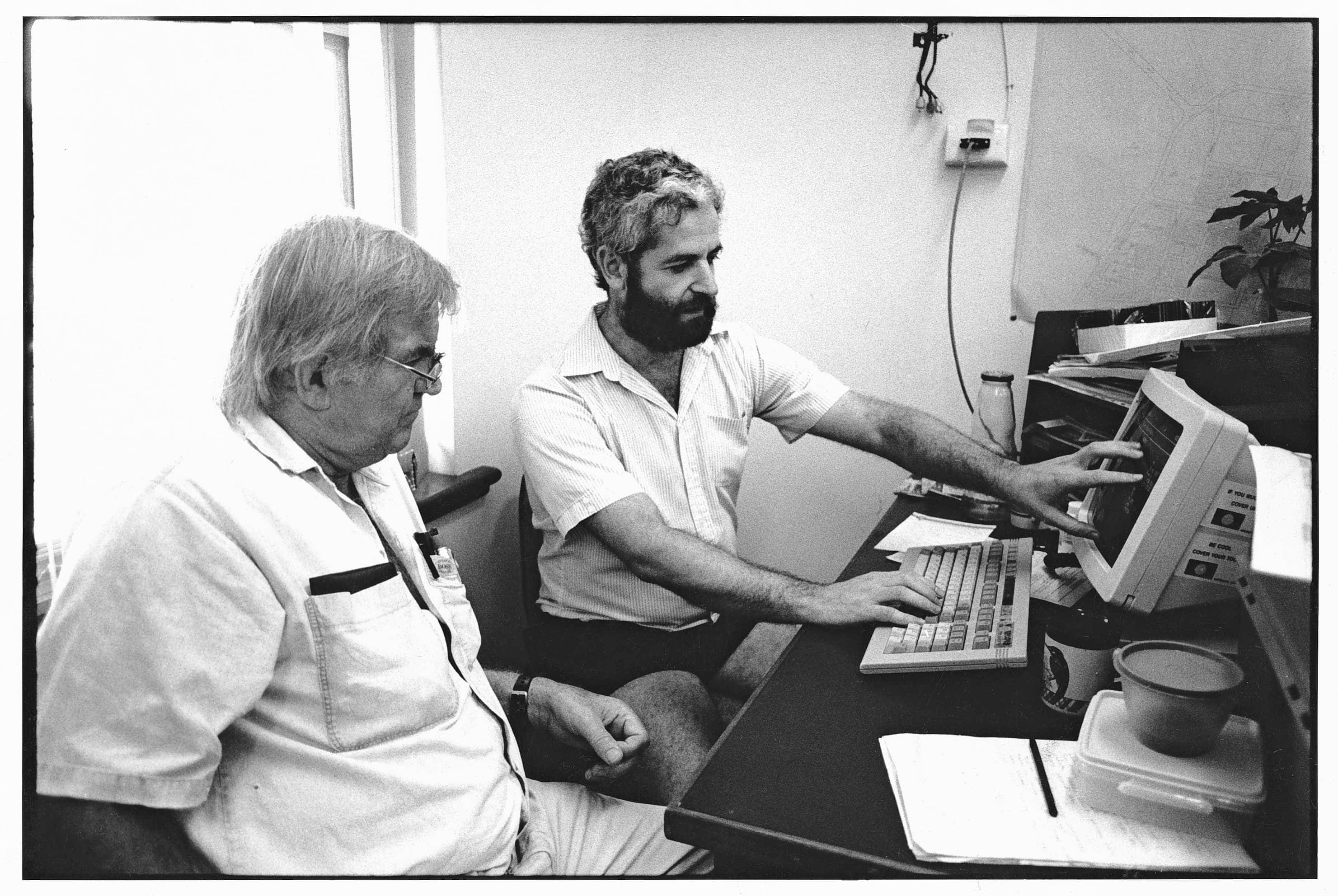 Fred Hollows looking at a computer