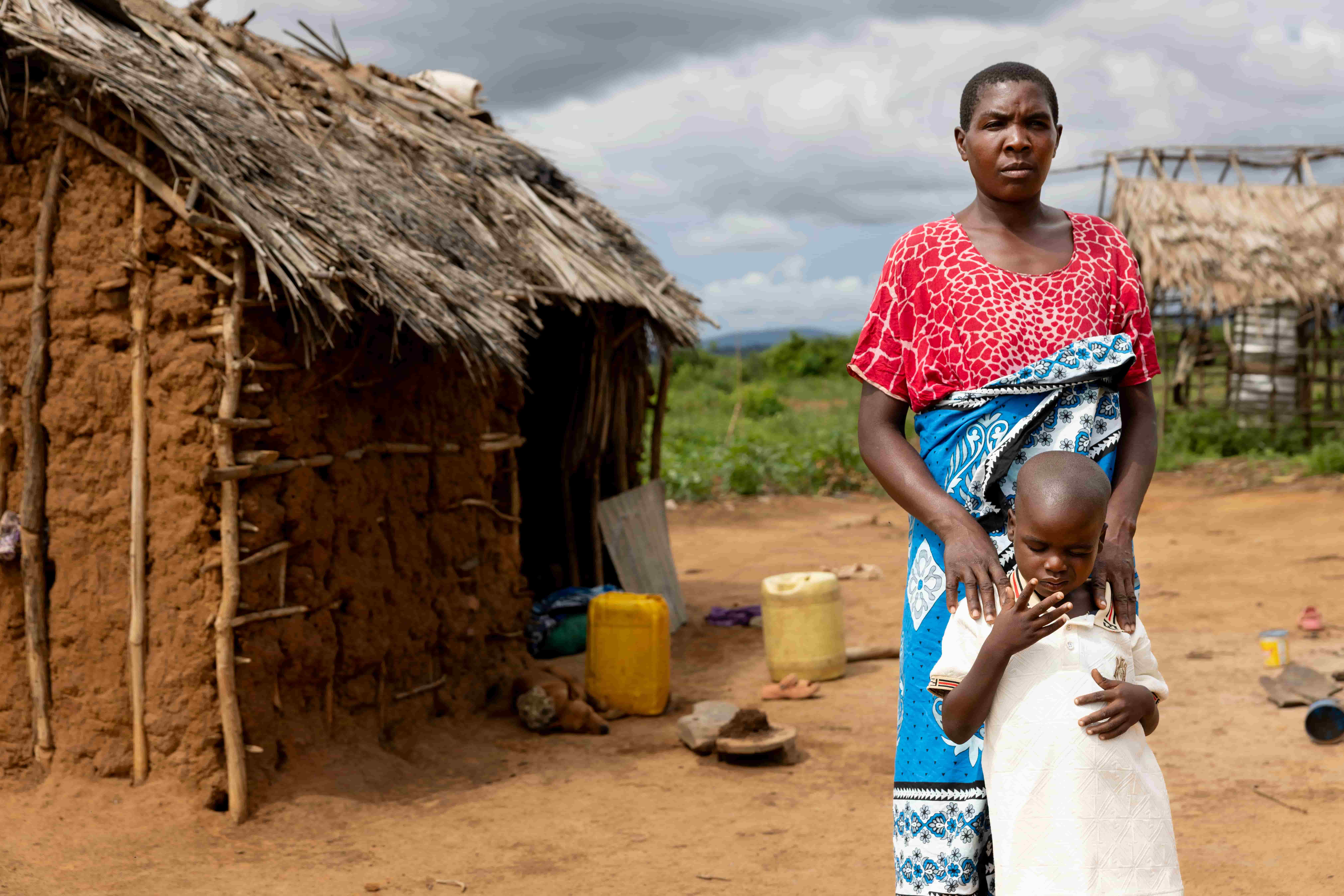 Jira and his mother, Fatima, standing in front of their home in remote Kenya.