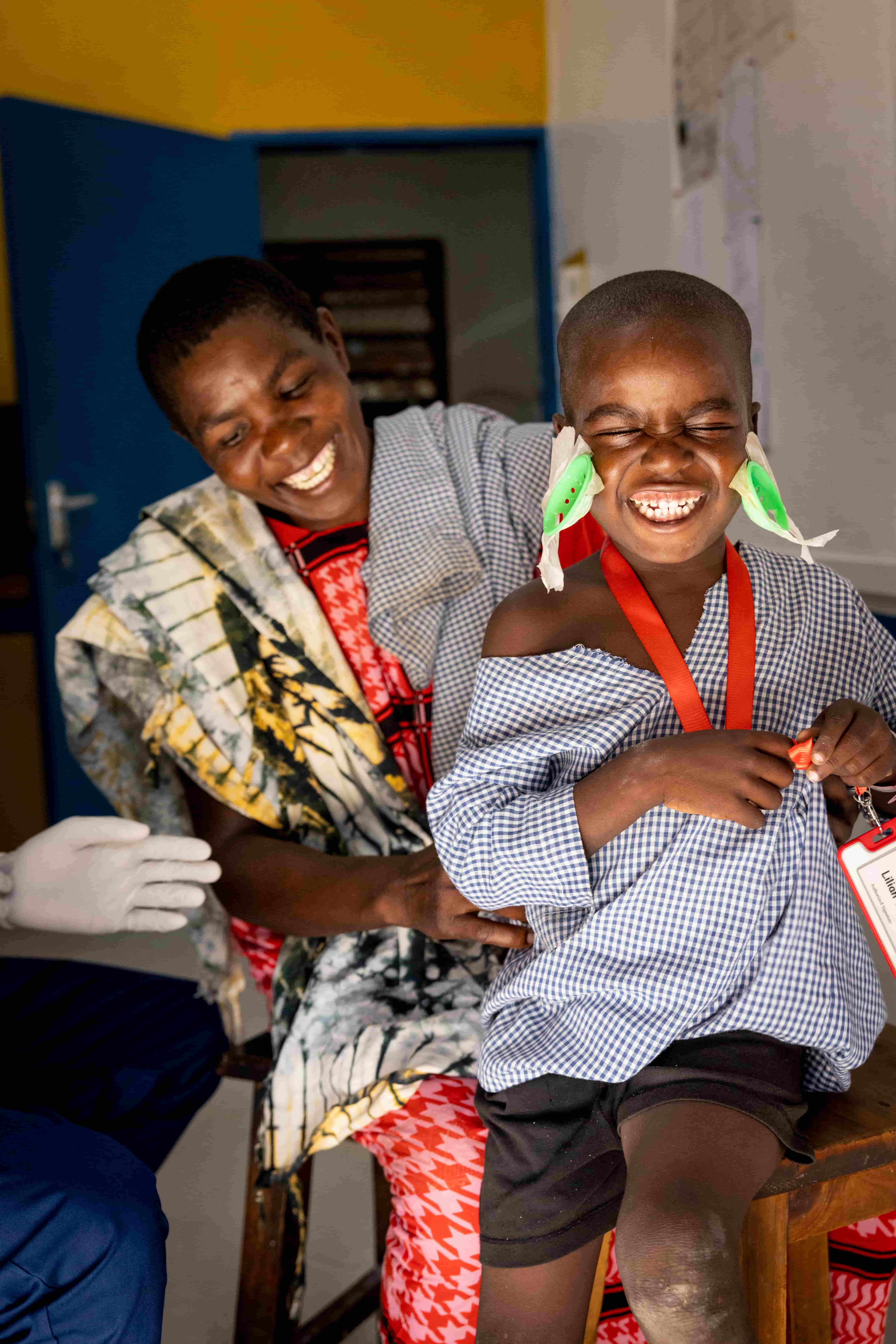 Jira and his mother smiling after his eye patches are removed. Jira can see again!