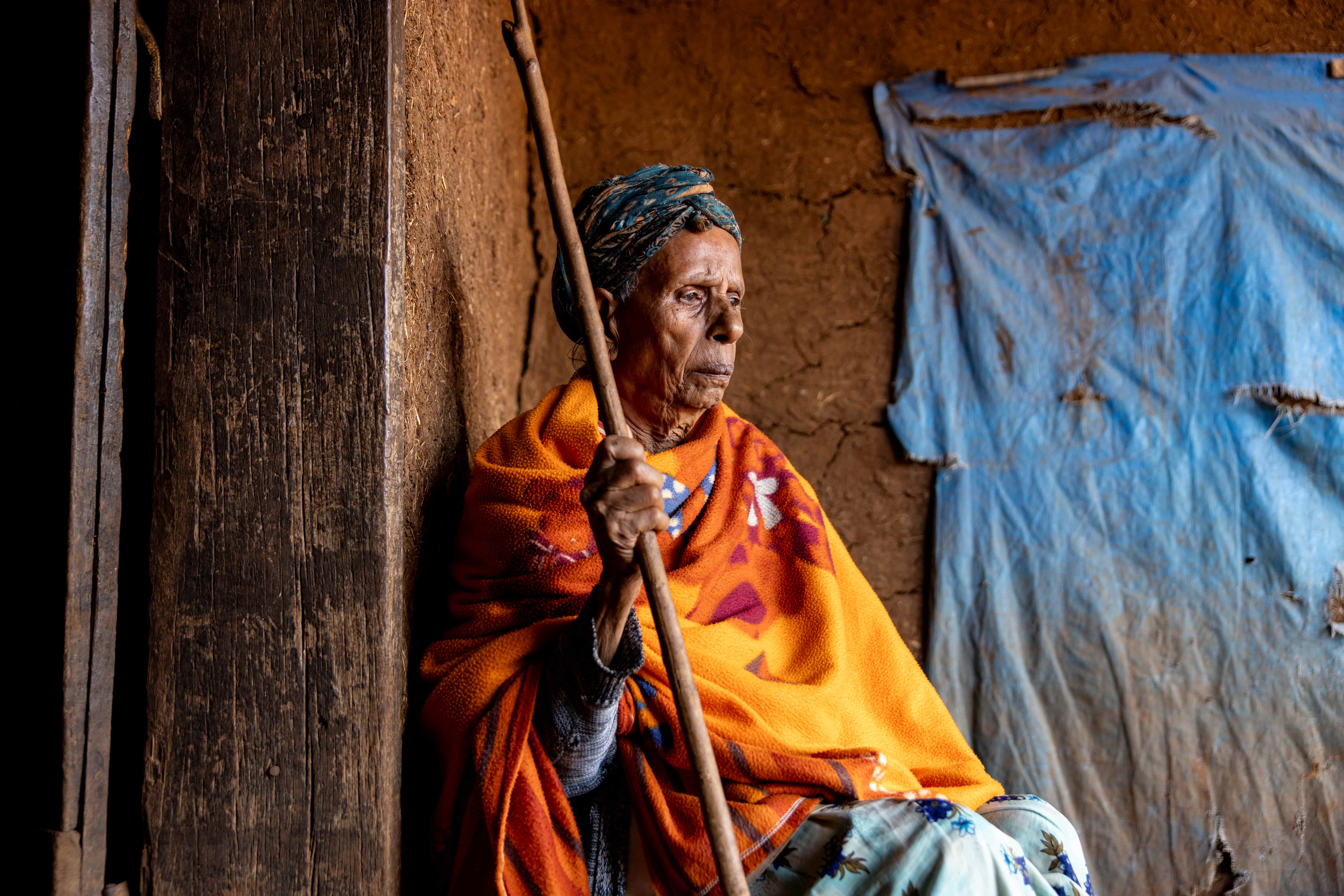 Bashadu Abdu lives alone in Ethiopia's Oromia province. After cataracts stole her sight, she could no longer collect firewood for a living and now relies on her daughter and neighbours to help her navigate the rough, muddy paths around her home.