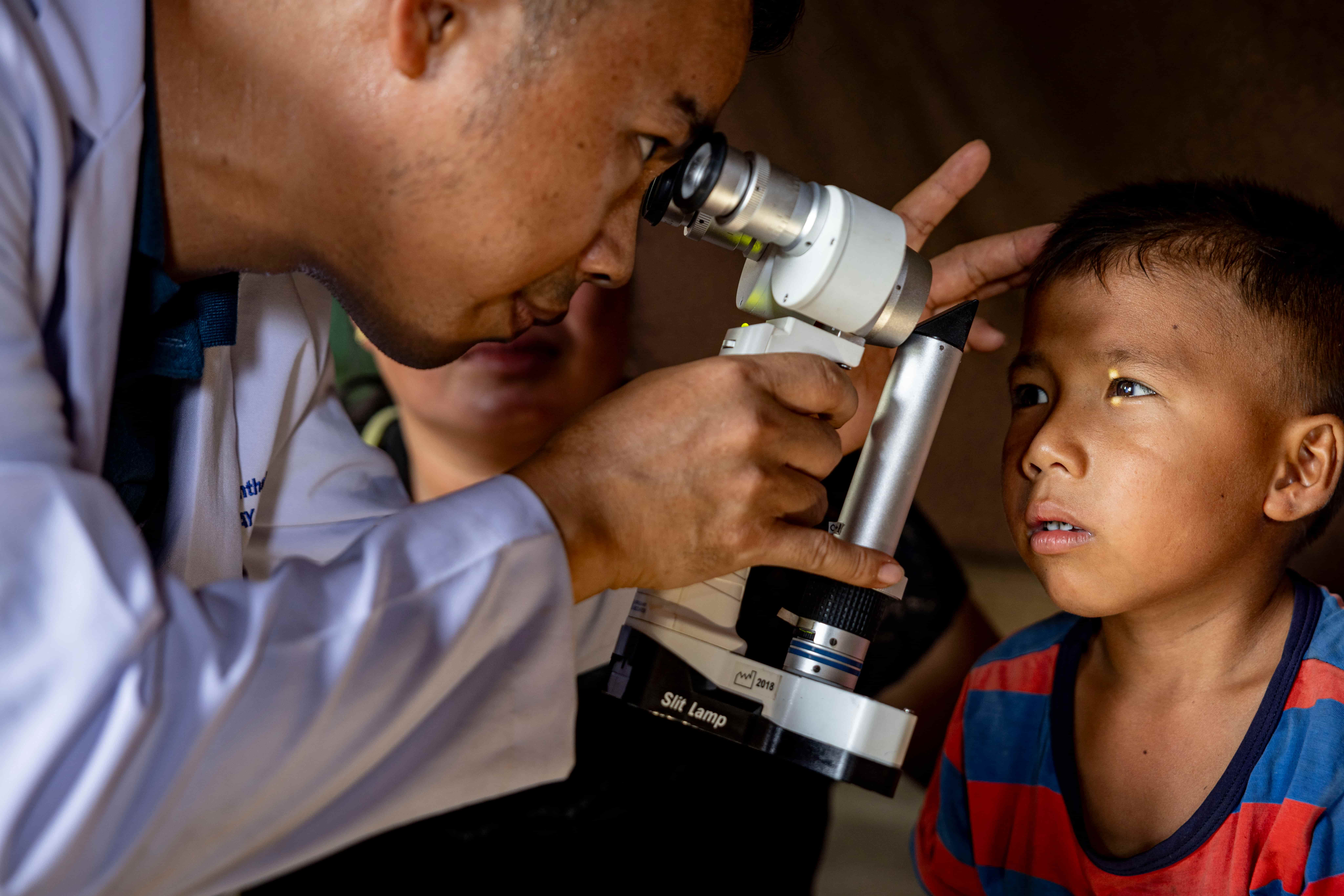 Dr Visay examining Lumi's eye.