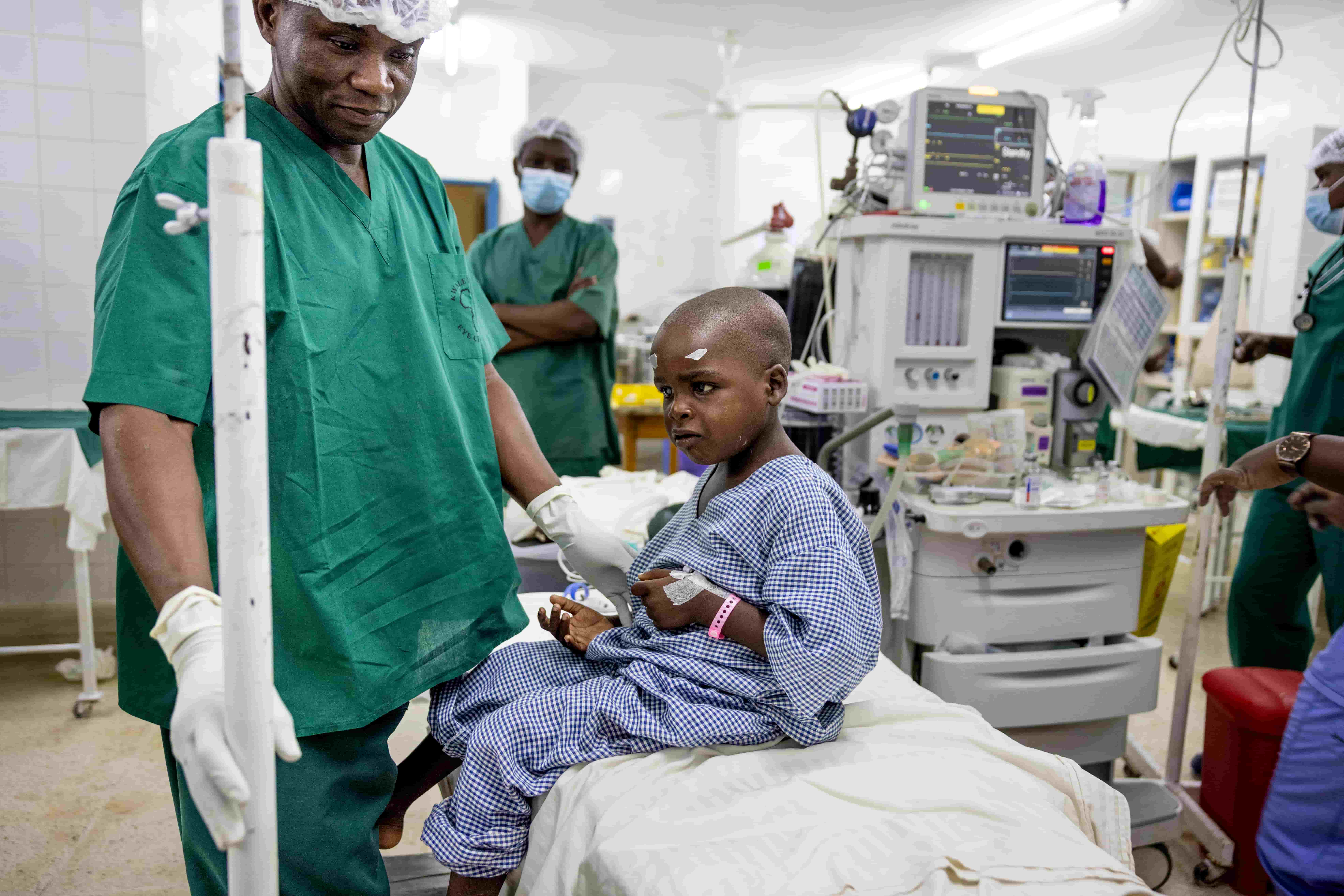Seven-year-old Jira at Kwale Eye Centre in Kenya, getting ready for cataract surgery—a simple intervention that helps prevent avoidable blindness and supports education and future productivity.