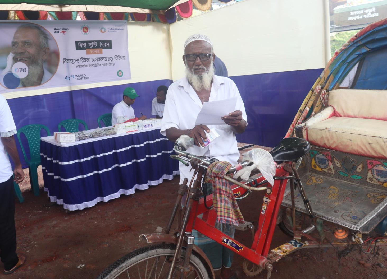 With his new glasses perched on his nose, Mohammed Ali looks into the camera, his expression full of hope and gratitude.