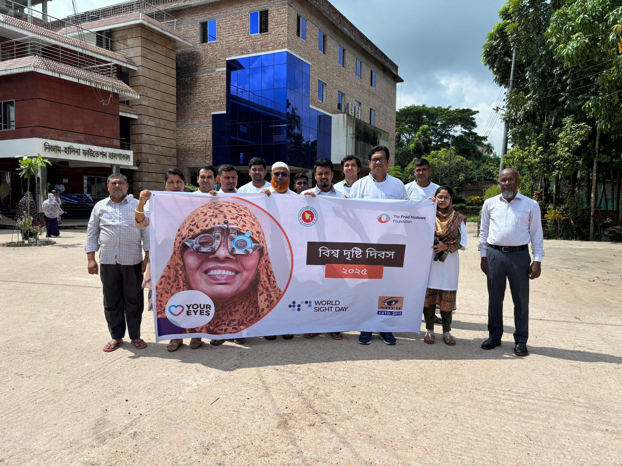 Community members and partners gather for a World Sight Day rally organised by the Nizam Hasina Foundation to raise awareness about the importance of eye health.