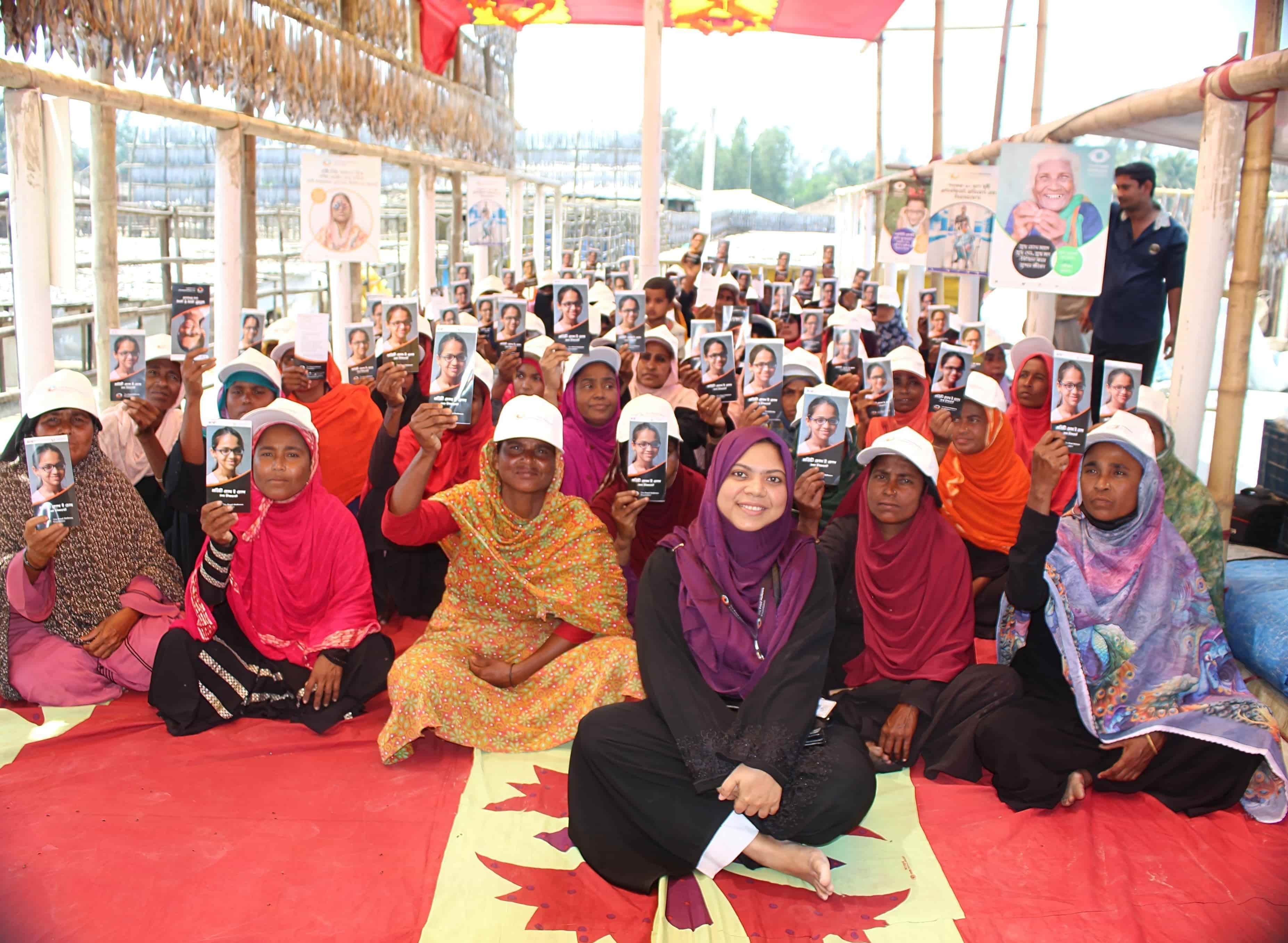 Community members in Bangladesh participate in an eye health education session led by The Fred Hollows Foundation.