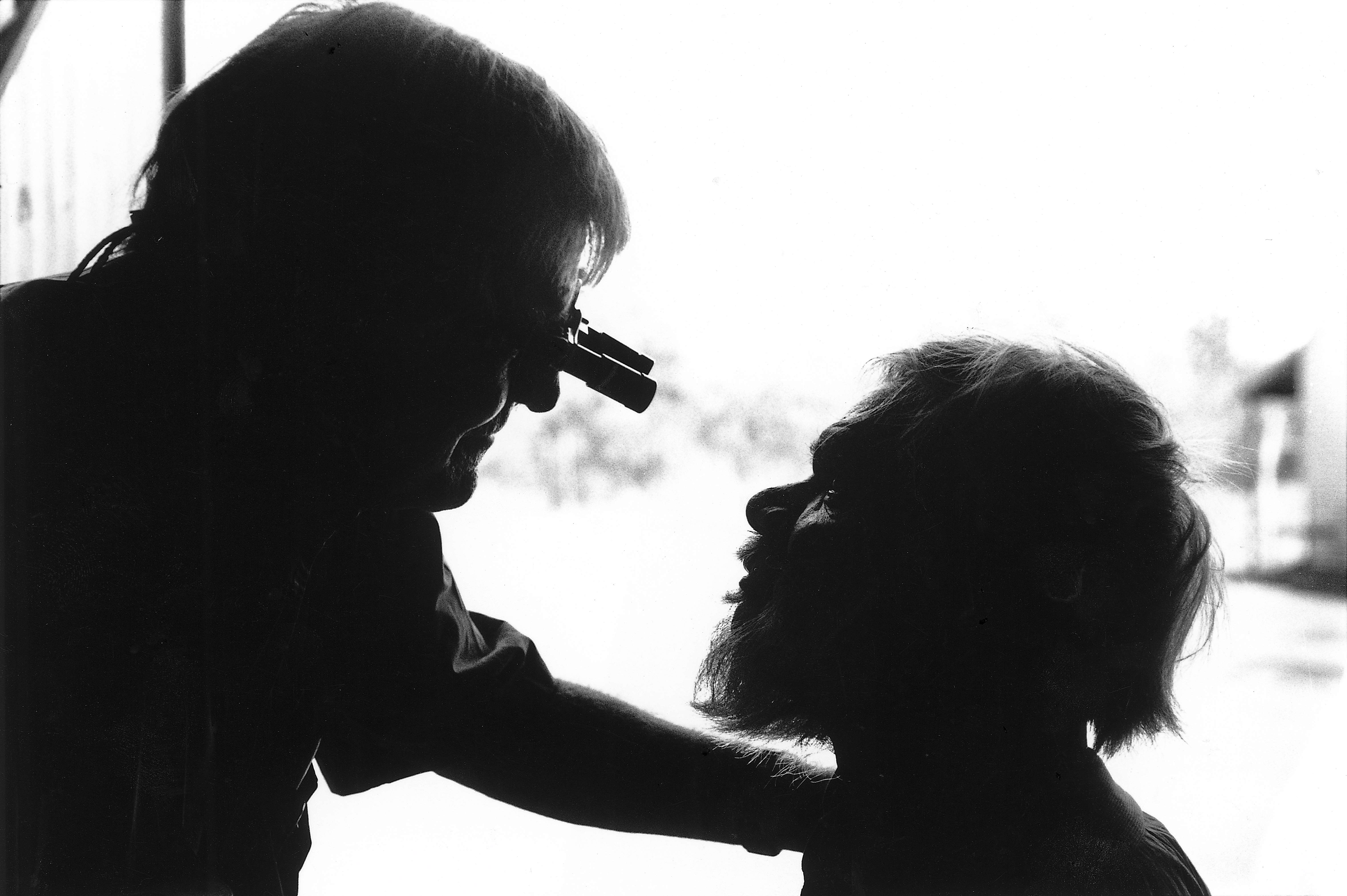 Fred Hollows inspects an Indigenous Australian's eye. 