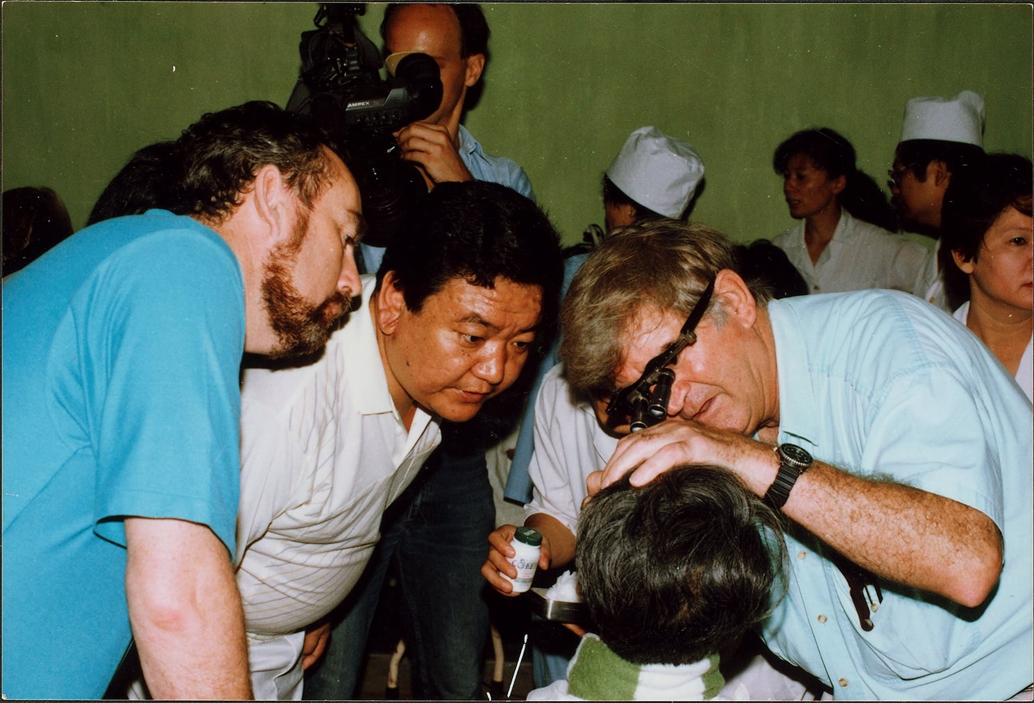 Dr Ruit and Fred Hollows examining a patient during a training workshop in Hanoi, Vietnam