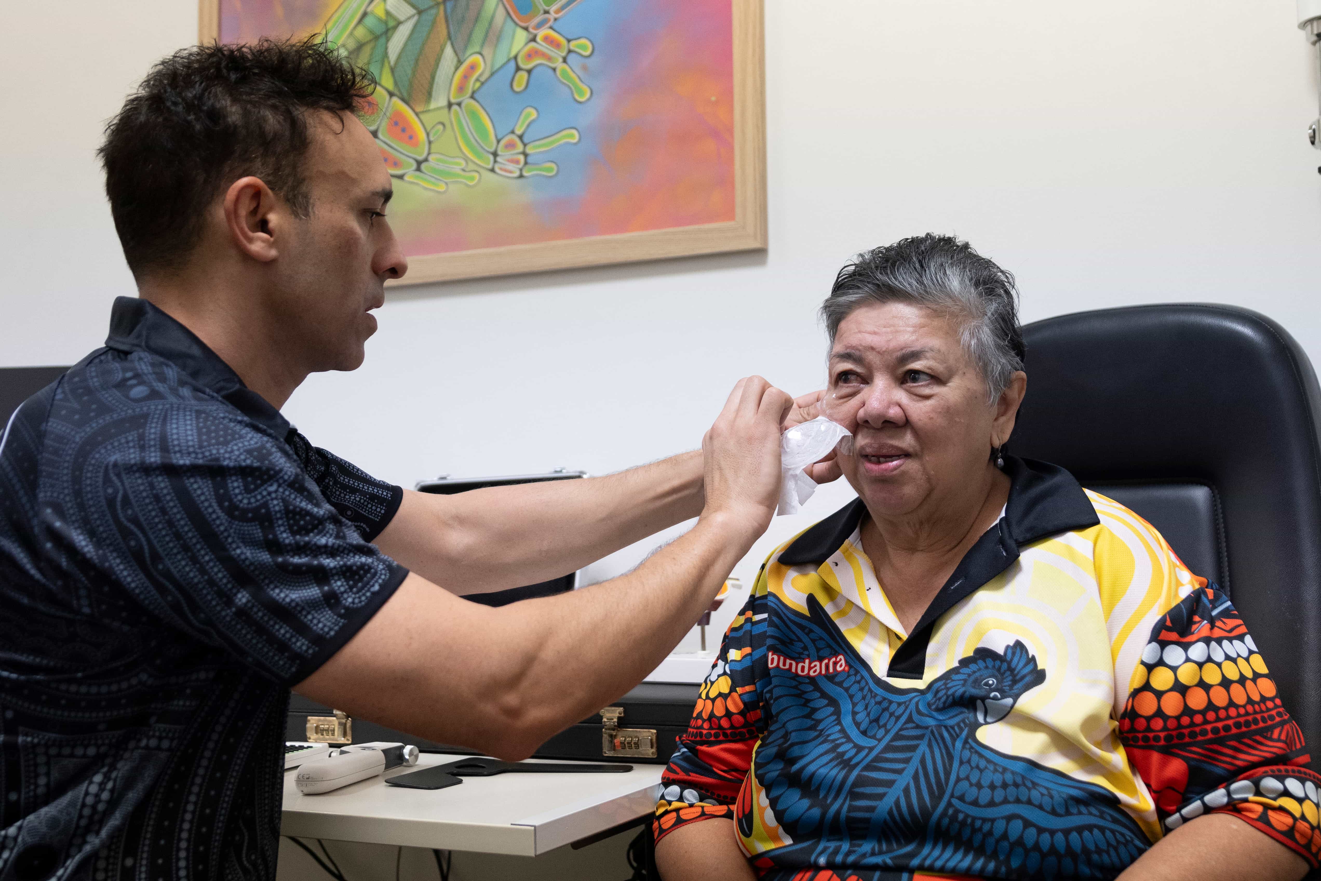 Dr Kris Rallah Baker removing Aunty Bs eye patch