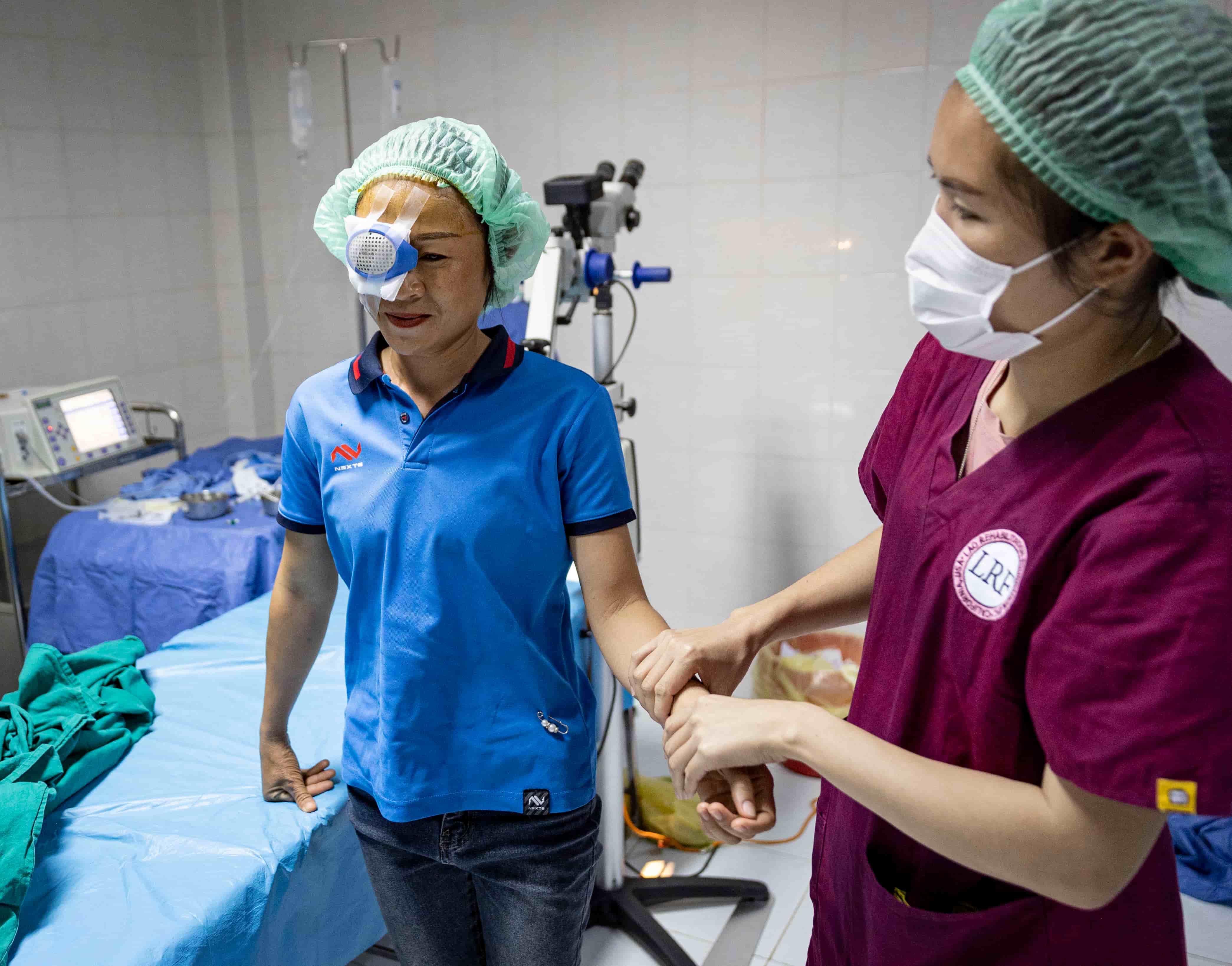 Bouachan being walked out from surgery with an eye patch on