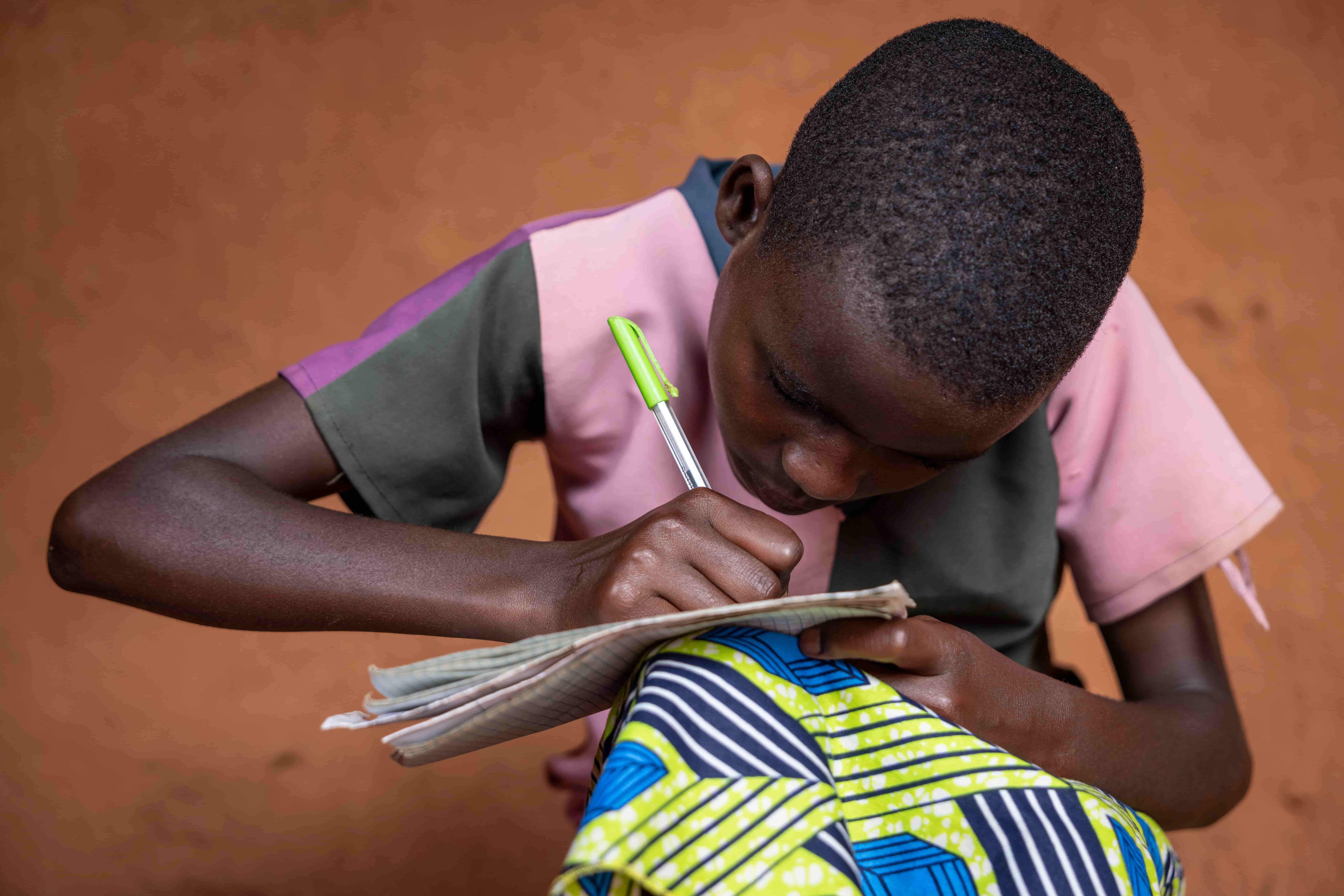 Before receiving sight-saving surgery, Valentine struggled to see clearly at school and often held her work close to her face. Early detection by a trained Community Health Worker helped connect her to treatment.