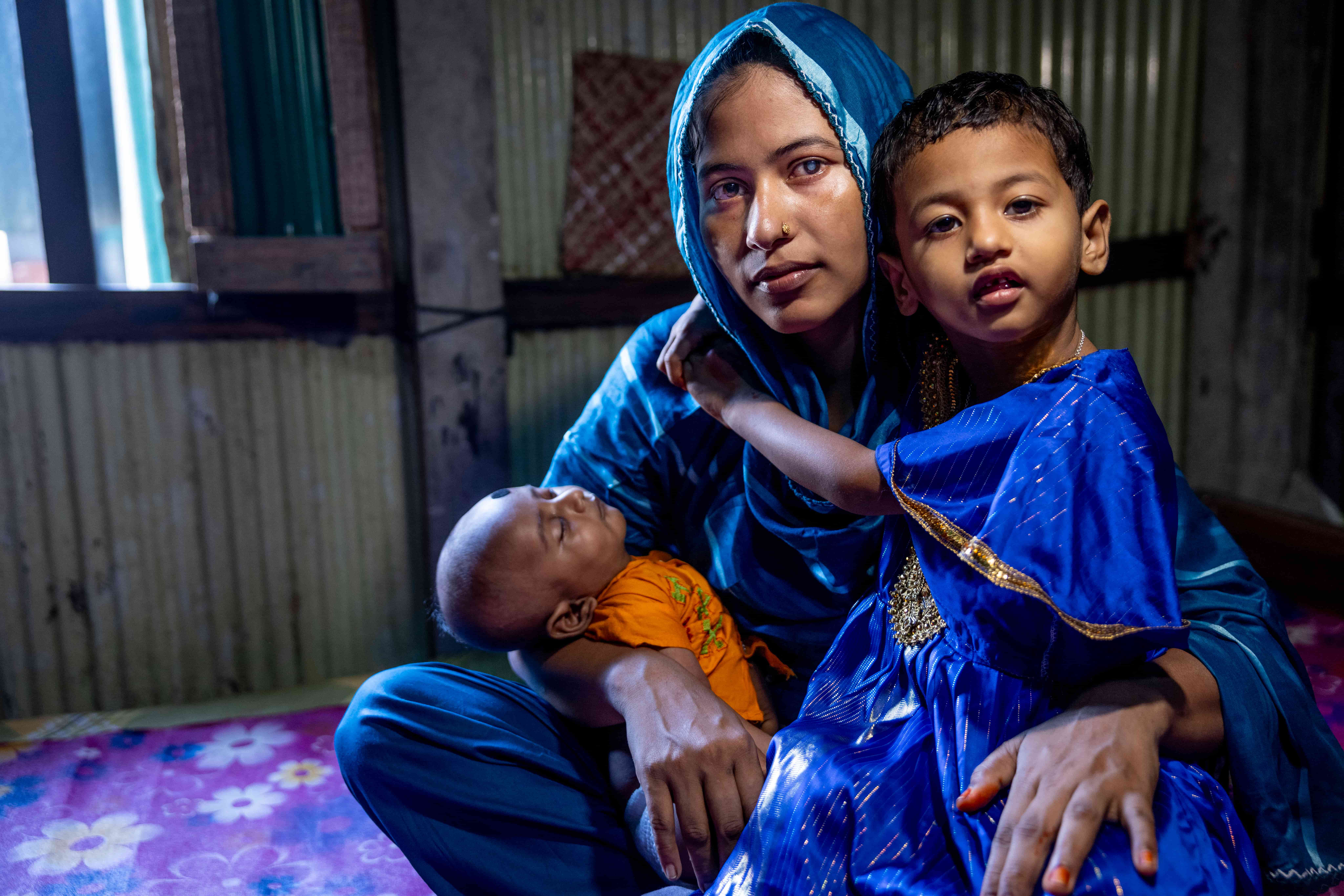 Parveen with her children at home