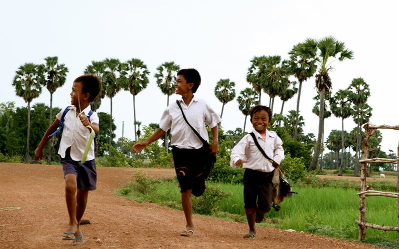 Cambodia three boys running