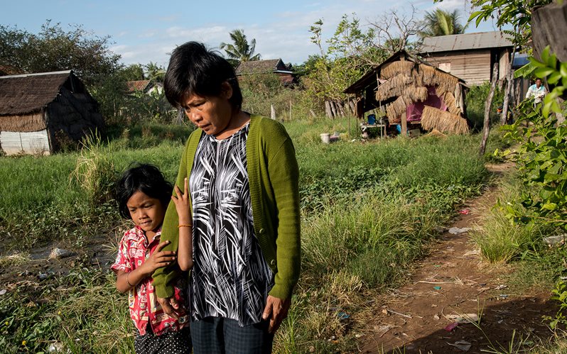 Vietnam Thol's daughter helps her walk