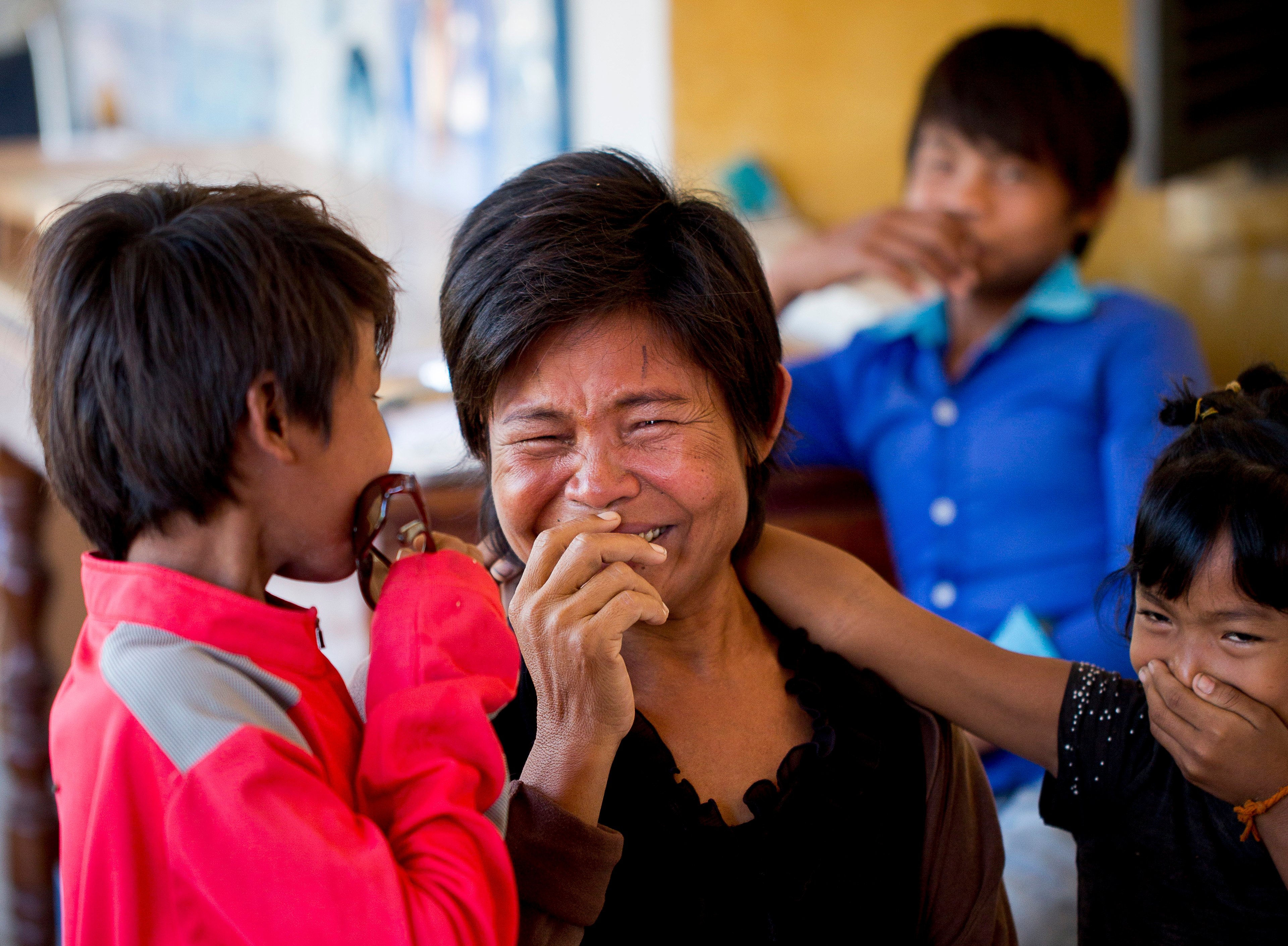 Thol crying to joy alongside her three children after her patches are removed