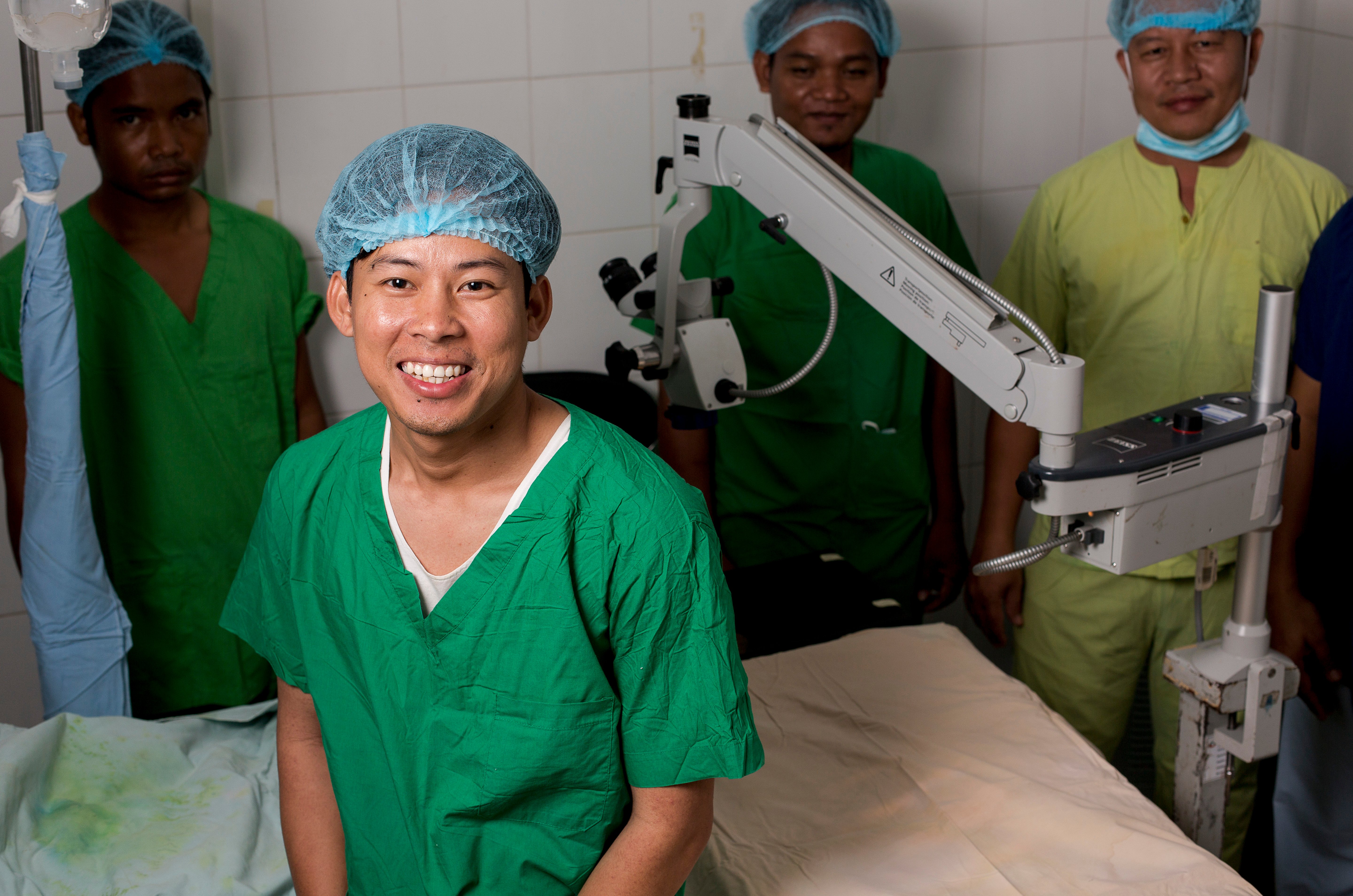 Dr Sarath in scrubs smiling at the camera